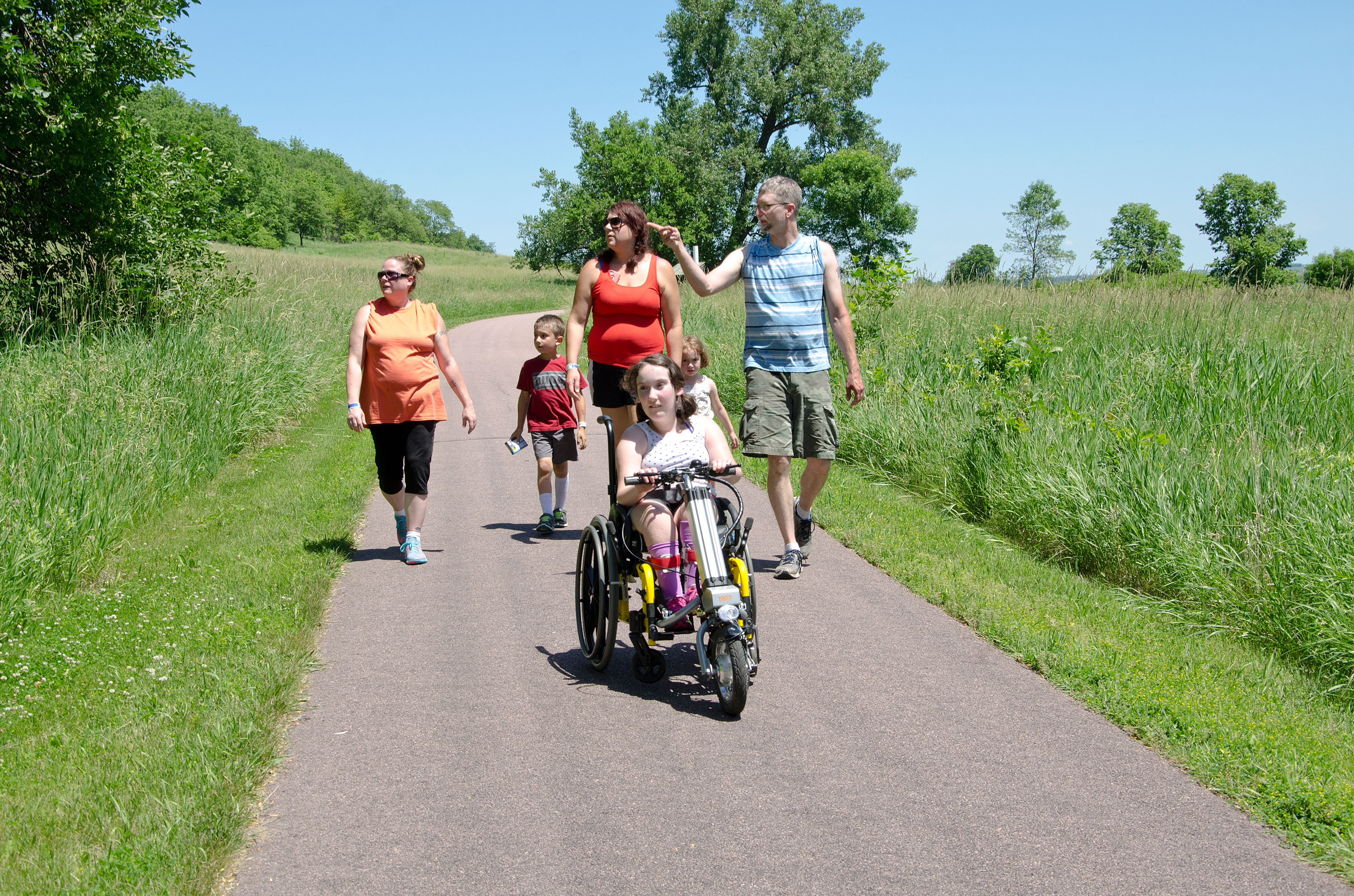 Family on wheelchair-accessible trail at Blue Mounds State Park