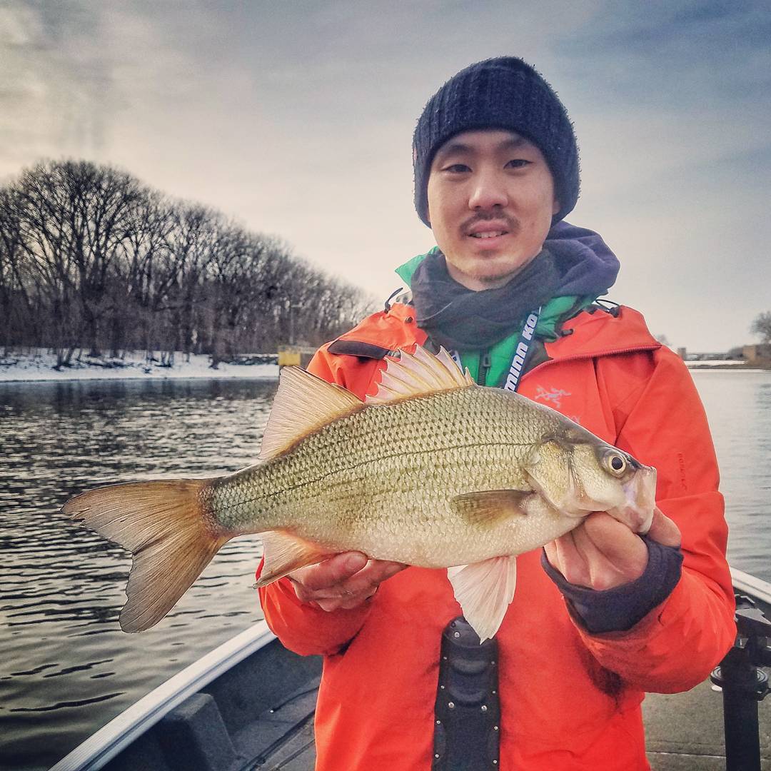 https://www.exploreminnesota.com/sites/default/files/2019-10/man-winter-fishing-in-red-wing-holding-white-bass.jpg