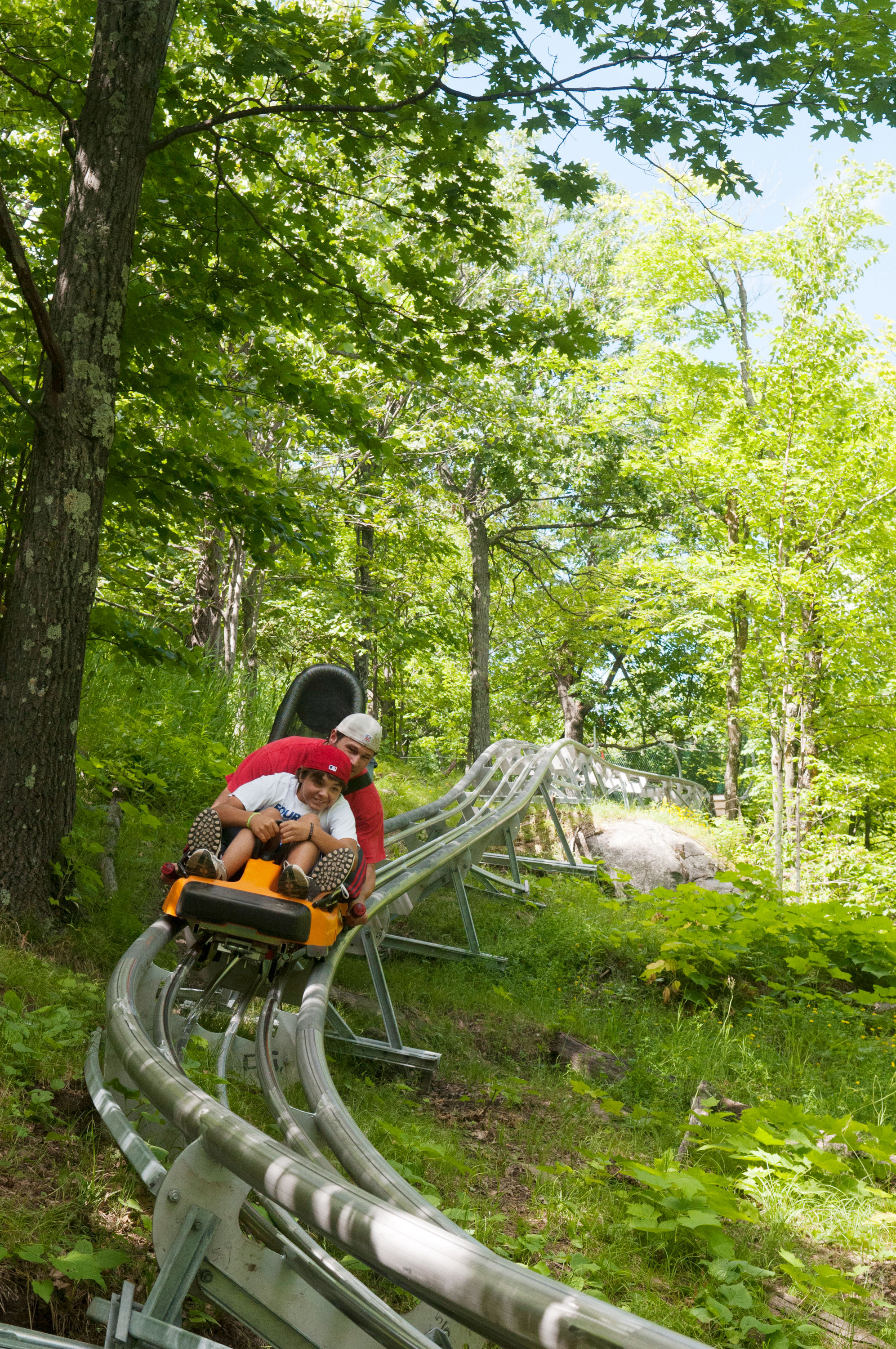 Man and son on Timber Twister ride