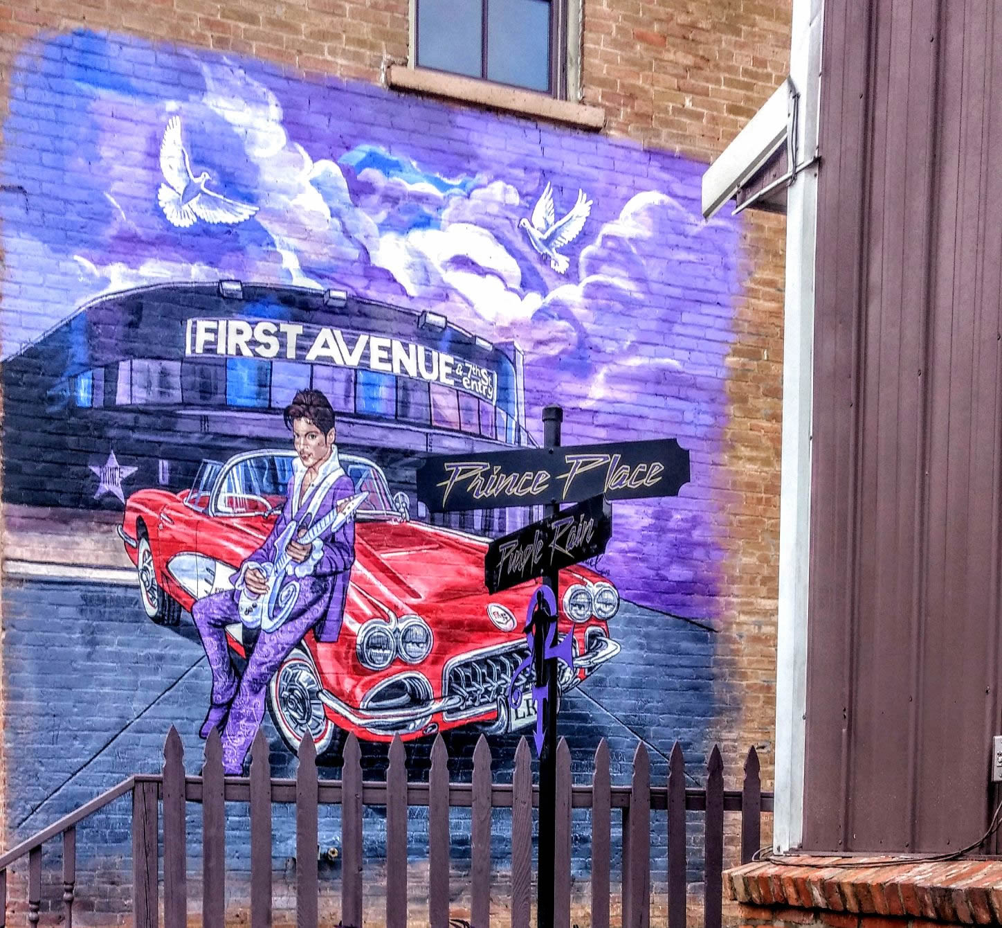 A mural of Prince on a brick building in downtown Henderson