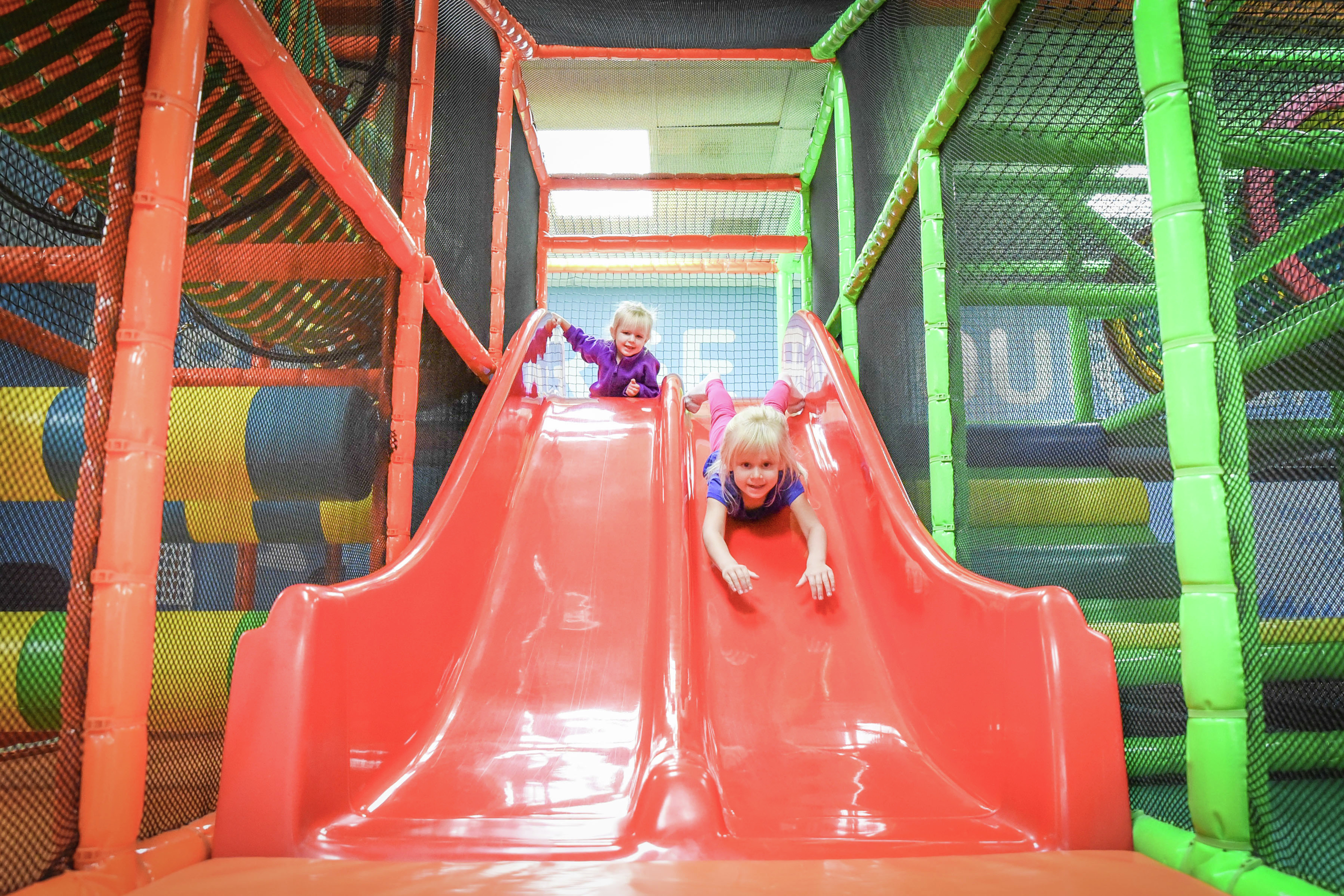 Kids on slide at indoor playground