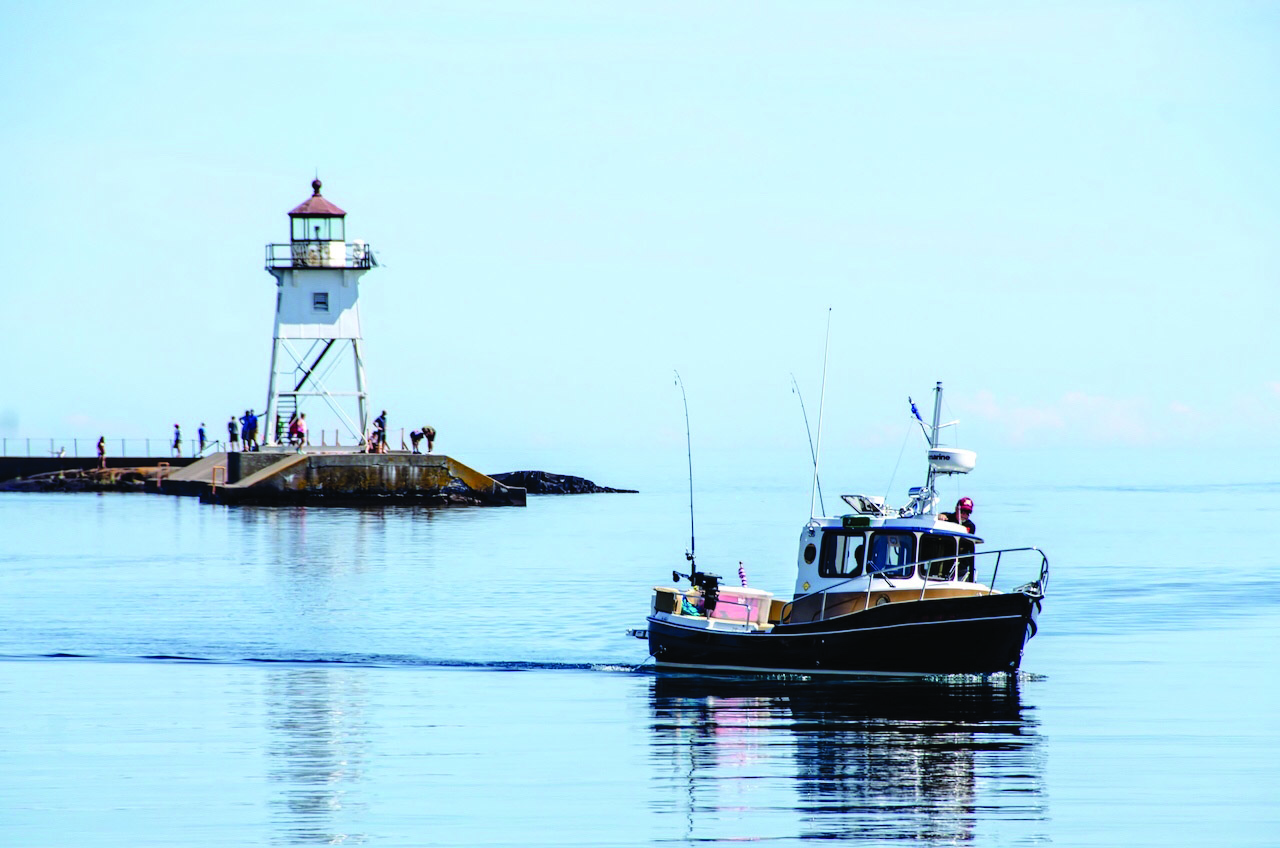 A charter fishing boat on Lake Superior in the Grand Marais harbor