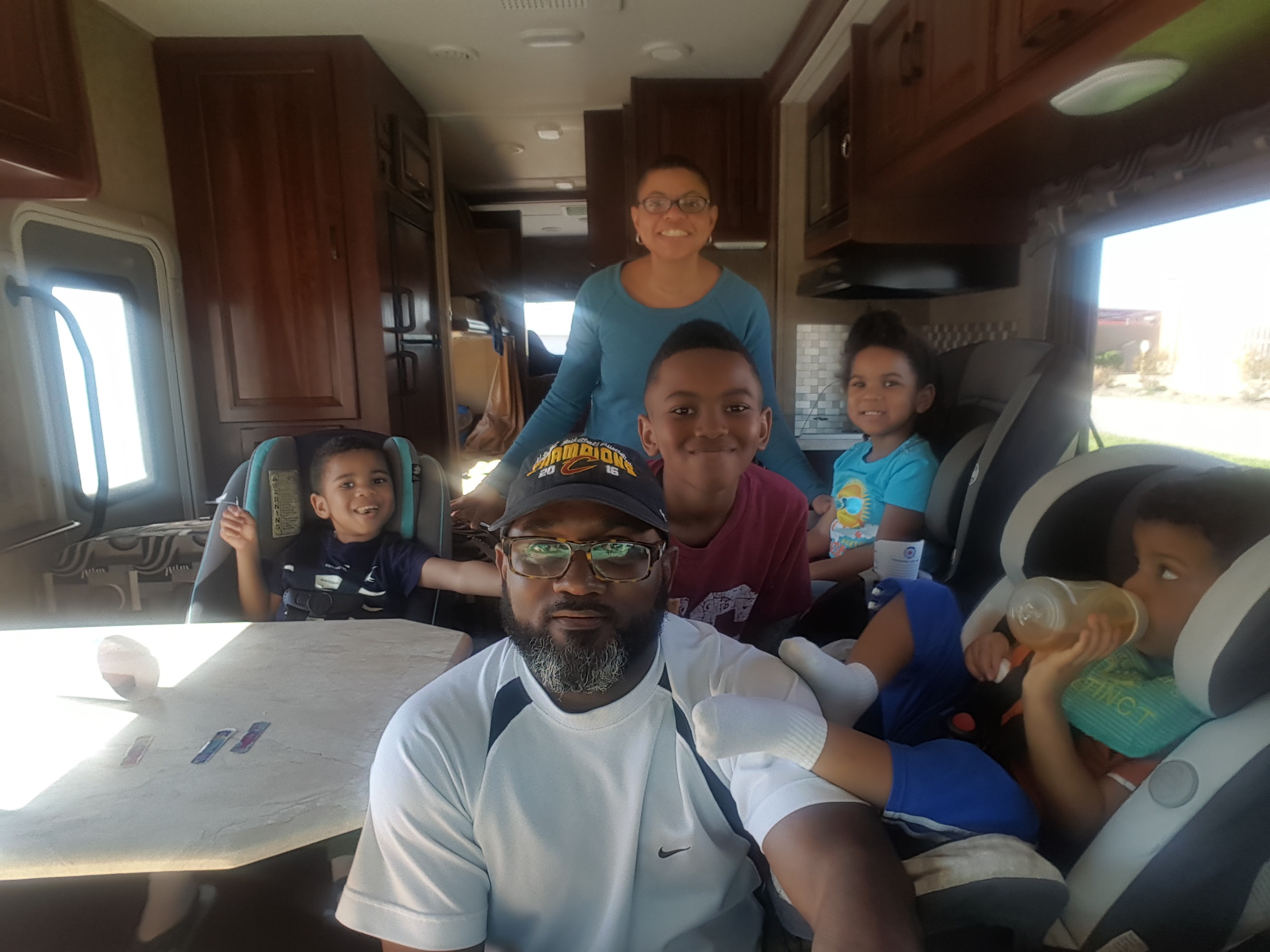 The Brundidge family poses for a photo inside their RV