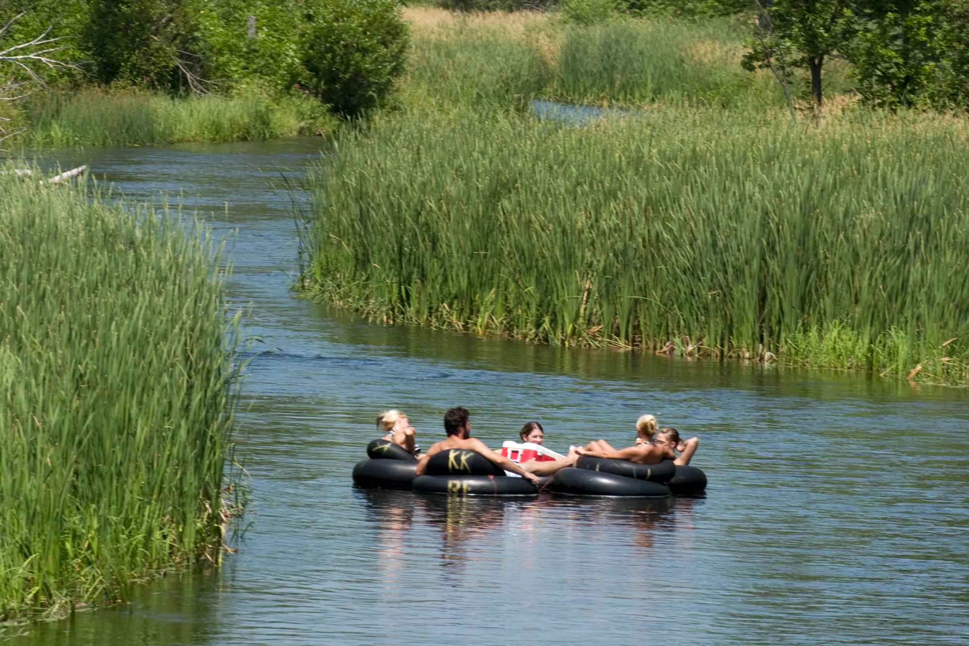 Group of friends river tubing on the Otter Tail River