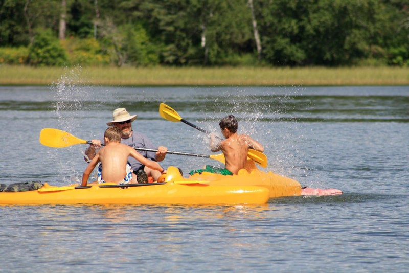 Family kayaking on Lake Itasca