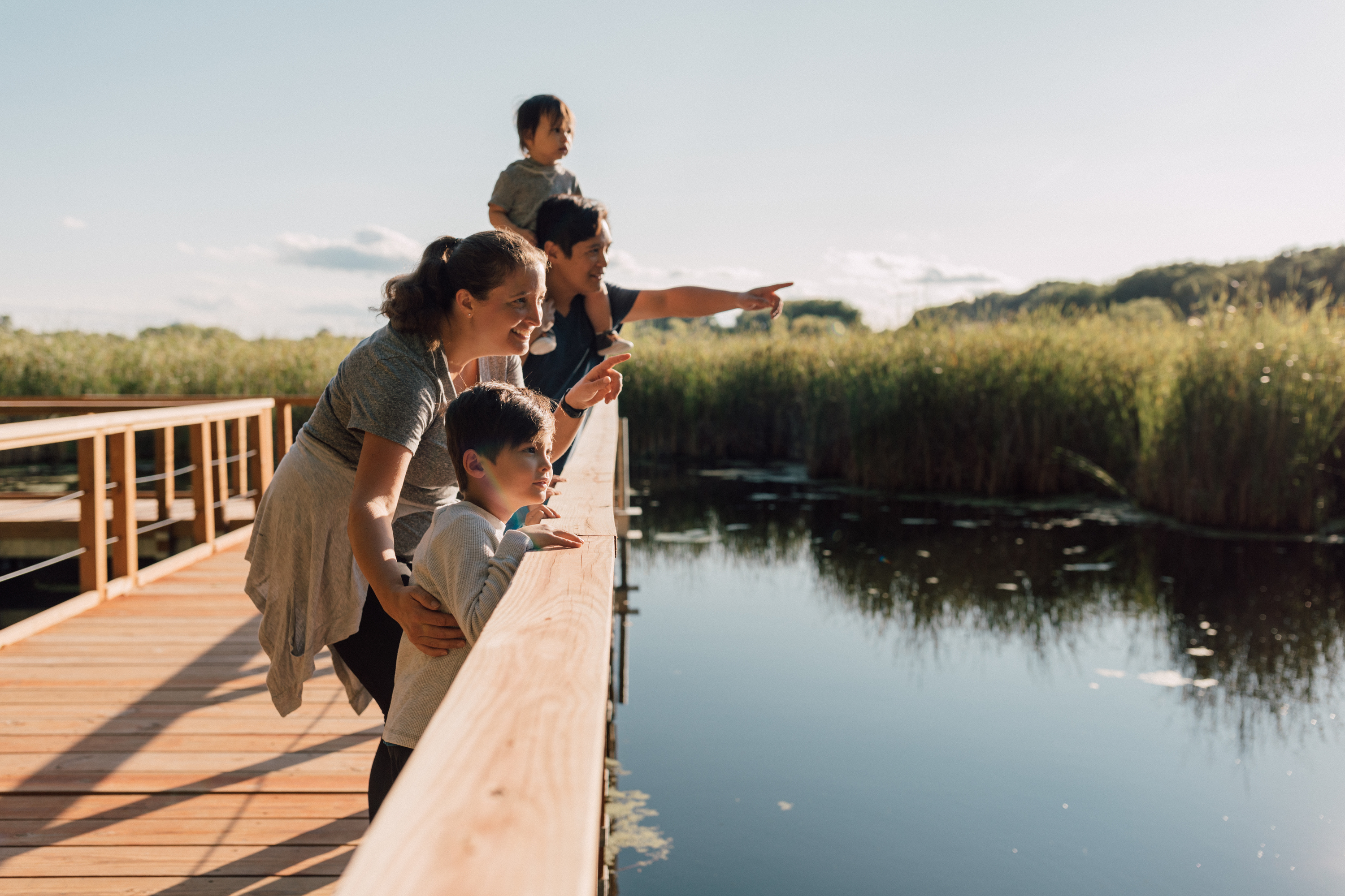 A family on a wood boardwalk at Wood Lake Nature Center