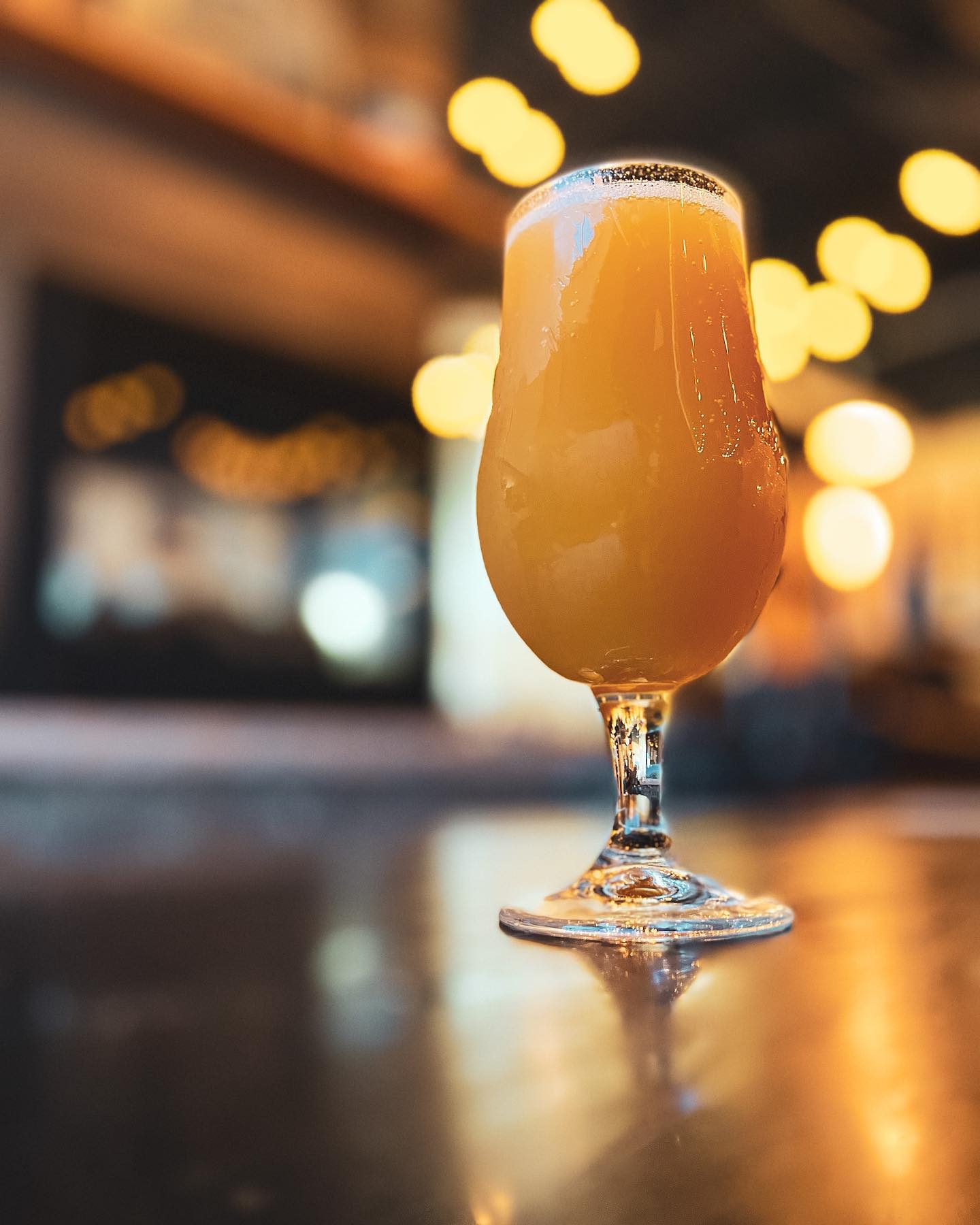 A pint of NA Peach Passion Fruit Sour at 9 Mile Brewing