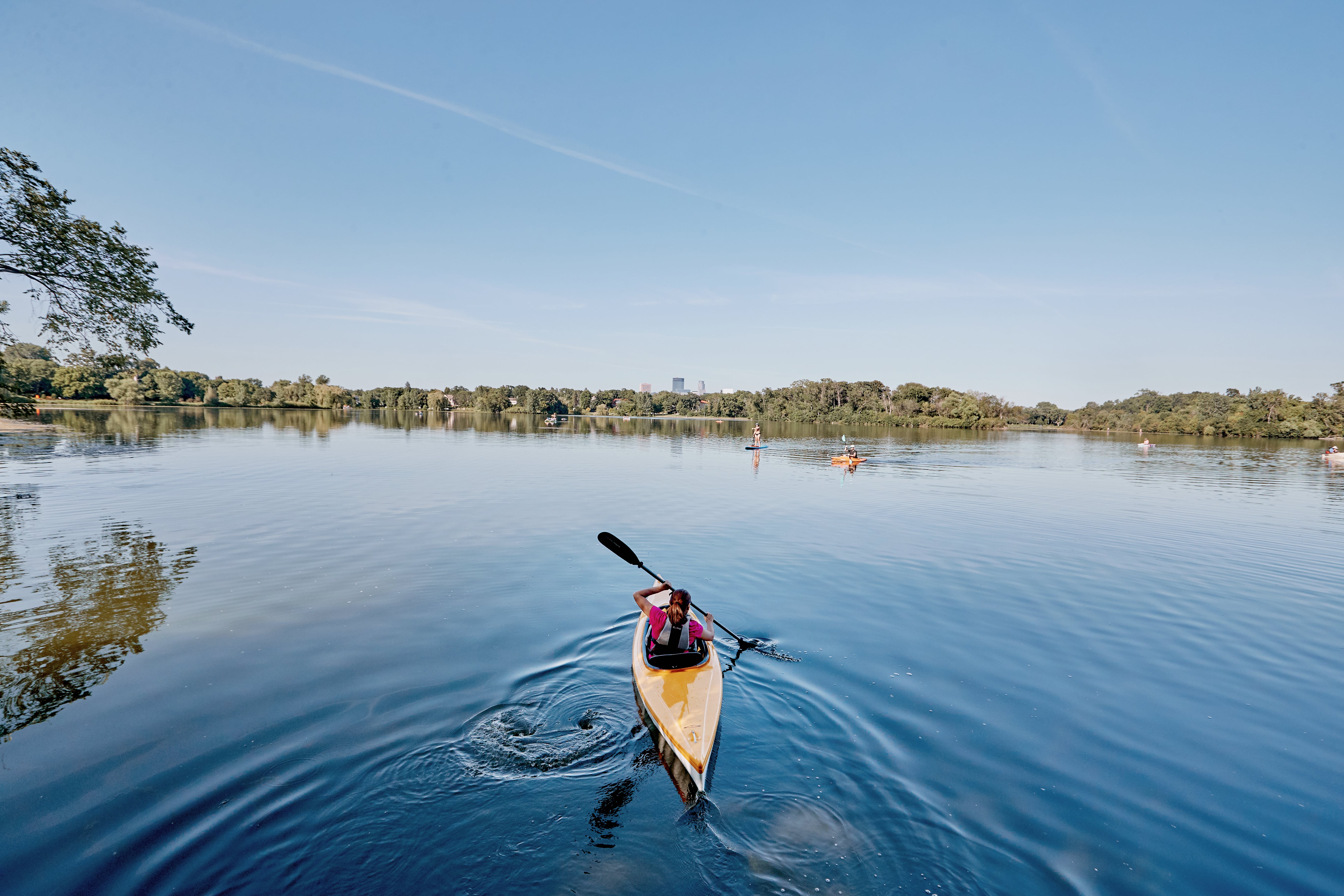 Person kayaking the Chain of Lakes in Minneapolis