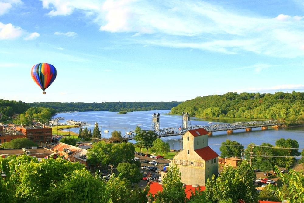 Hot air balloon floating over the city of Stillwater and the St. Croix River