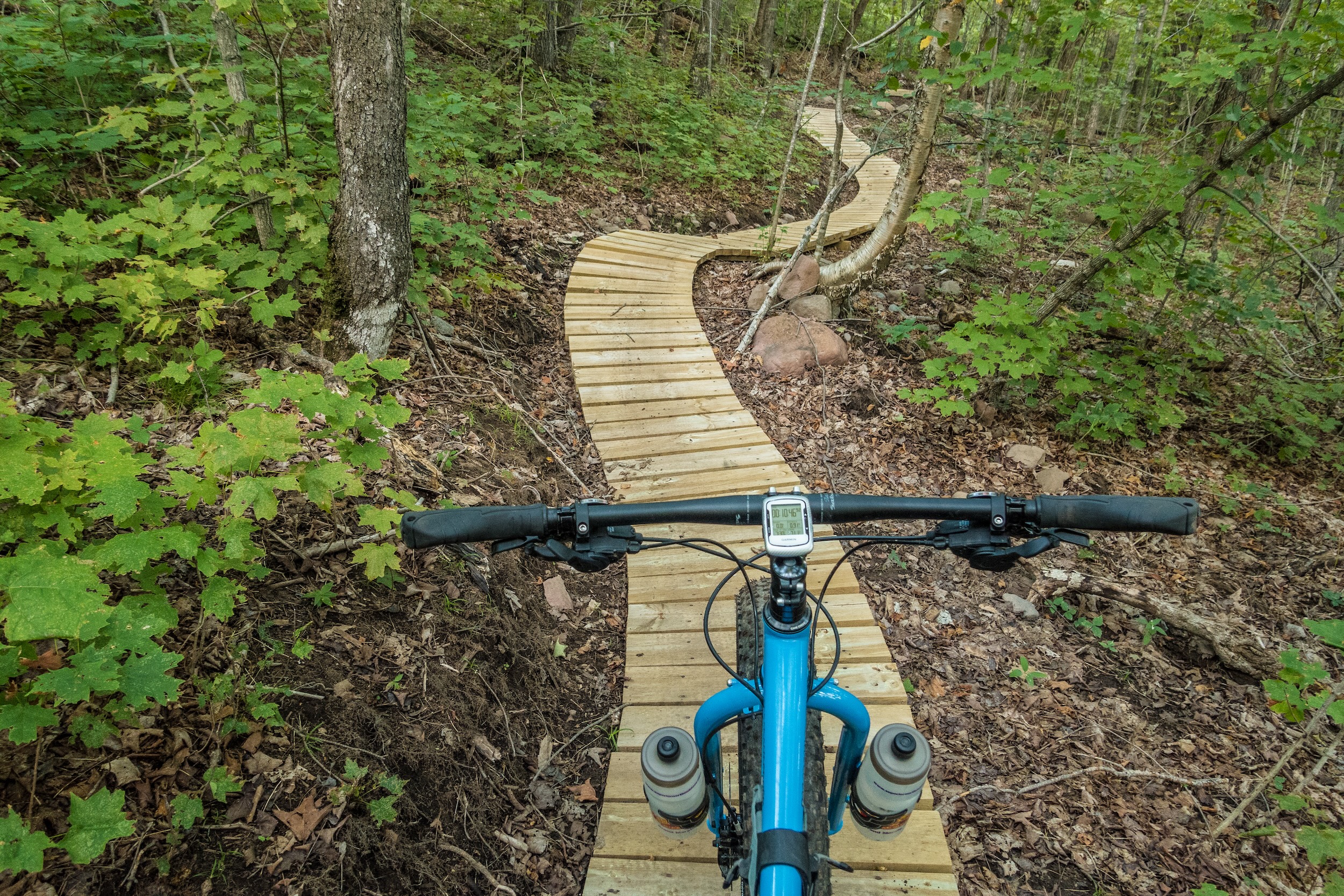 A mountain biker rides down the trail at Britton Peak
