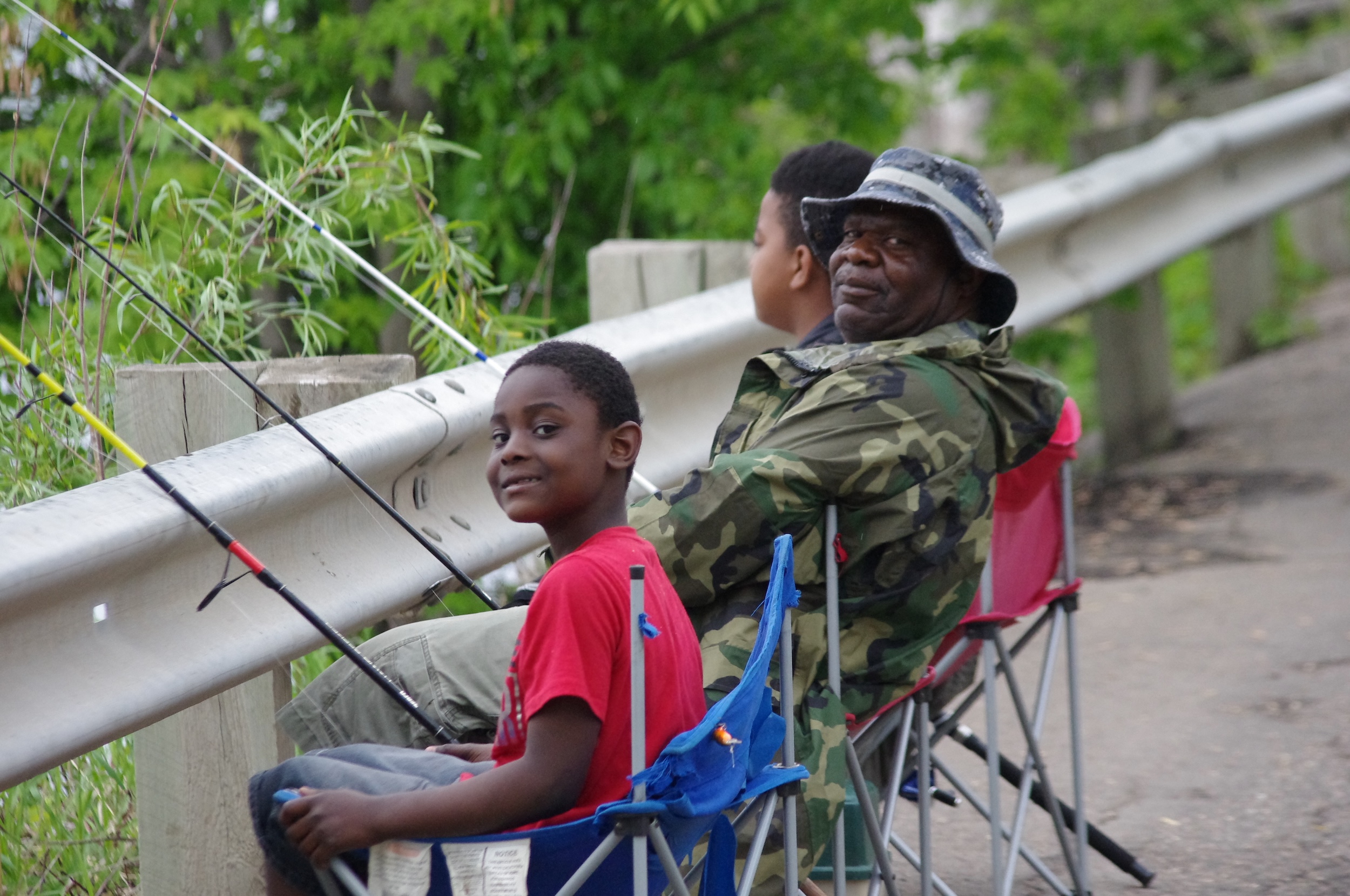 A family fishing along the Mississippi River in St. Paul