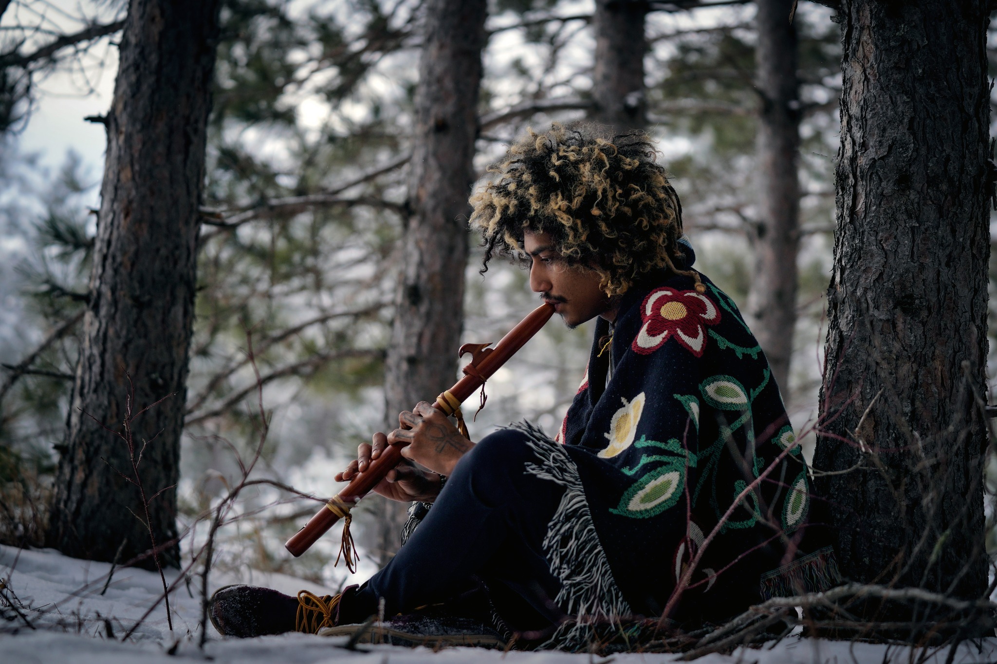 A model wears a blanket from Heart Berry