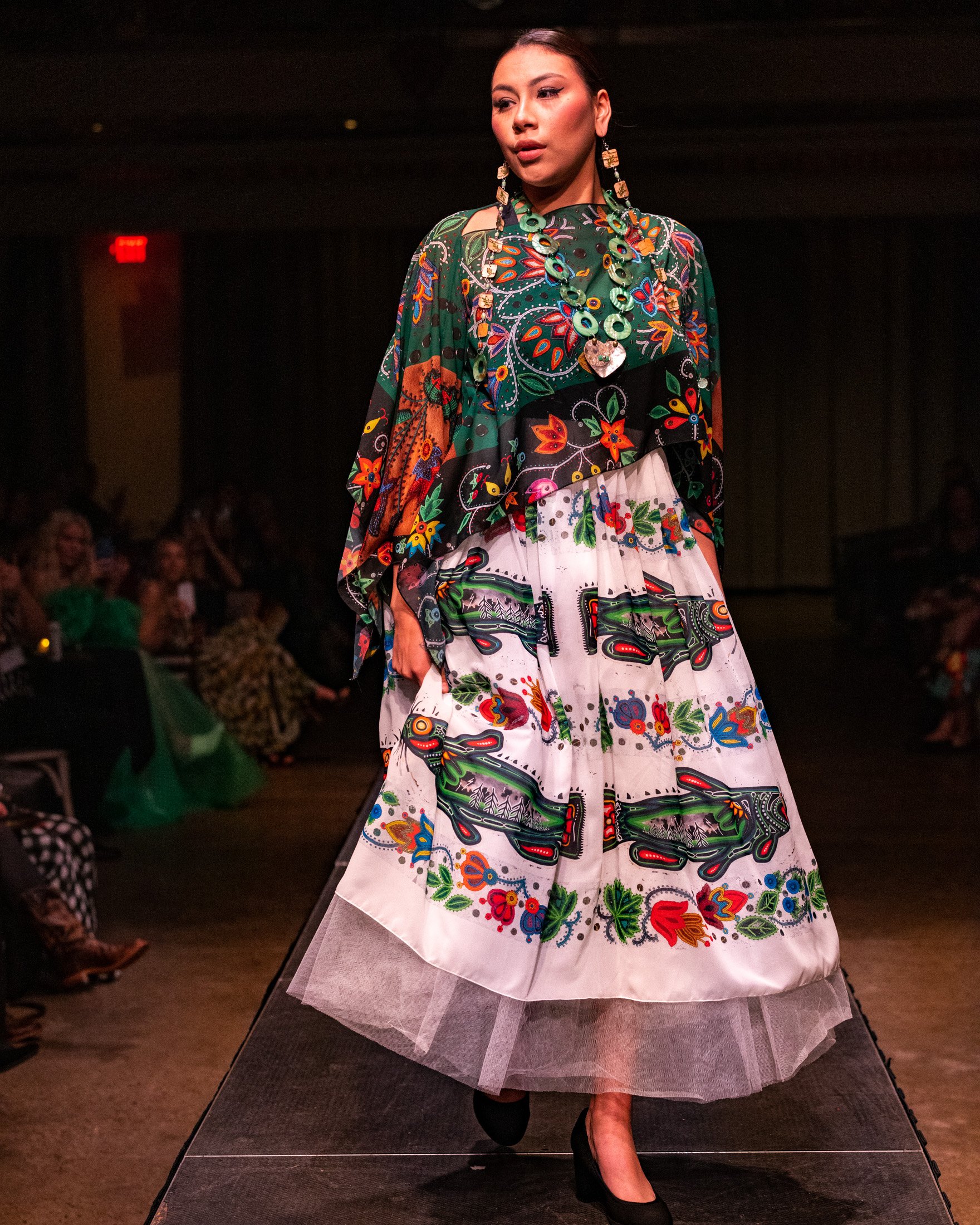 A fashion show features the work of IamAnishinaabe designer Delina White