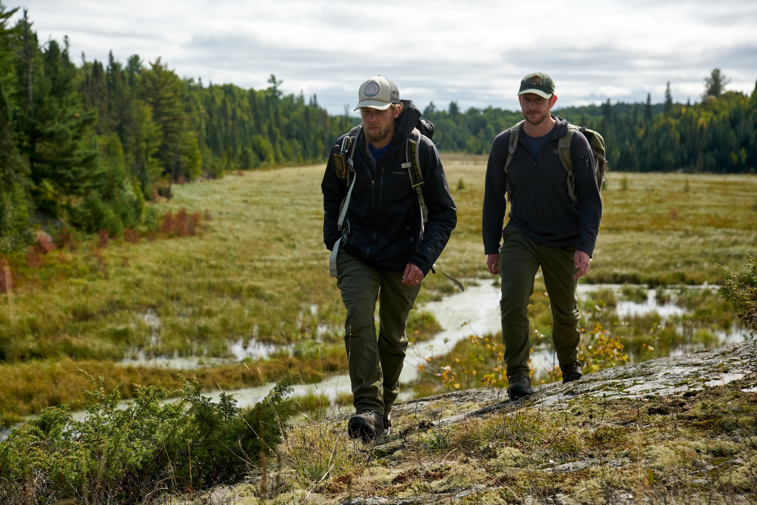 Voyageurs National Park visitors hiking with backpacks