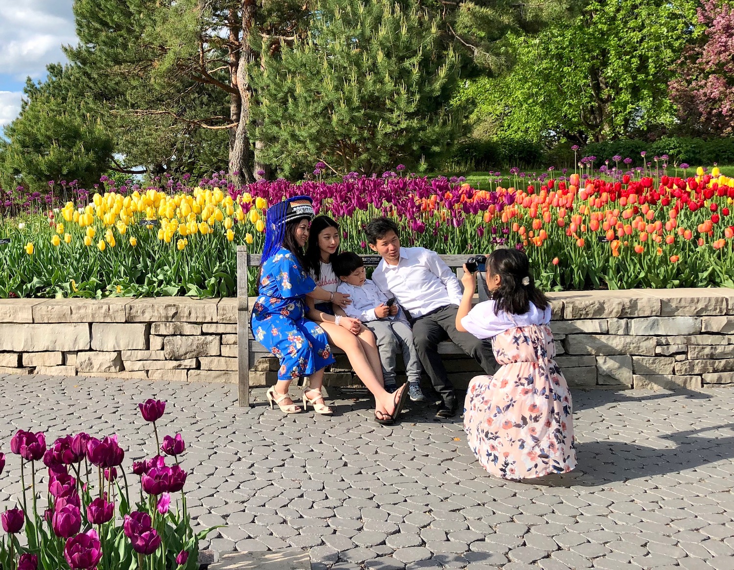A Hmong family takes a spring bloom photo at Minnesota Landscape Arboretum