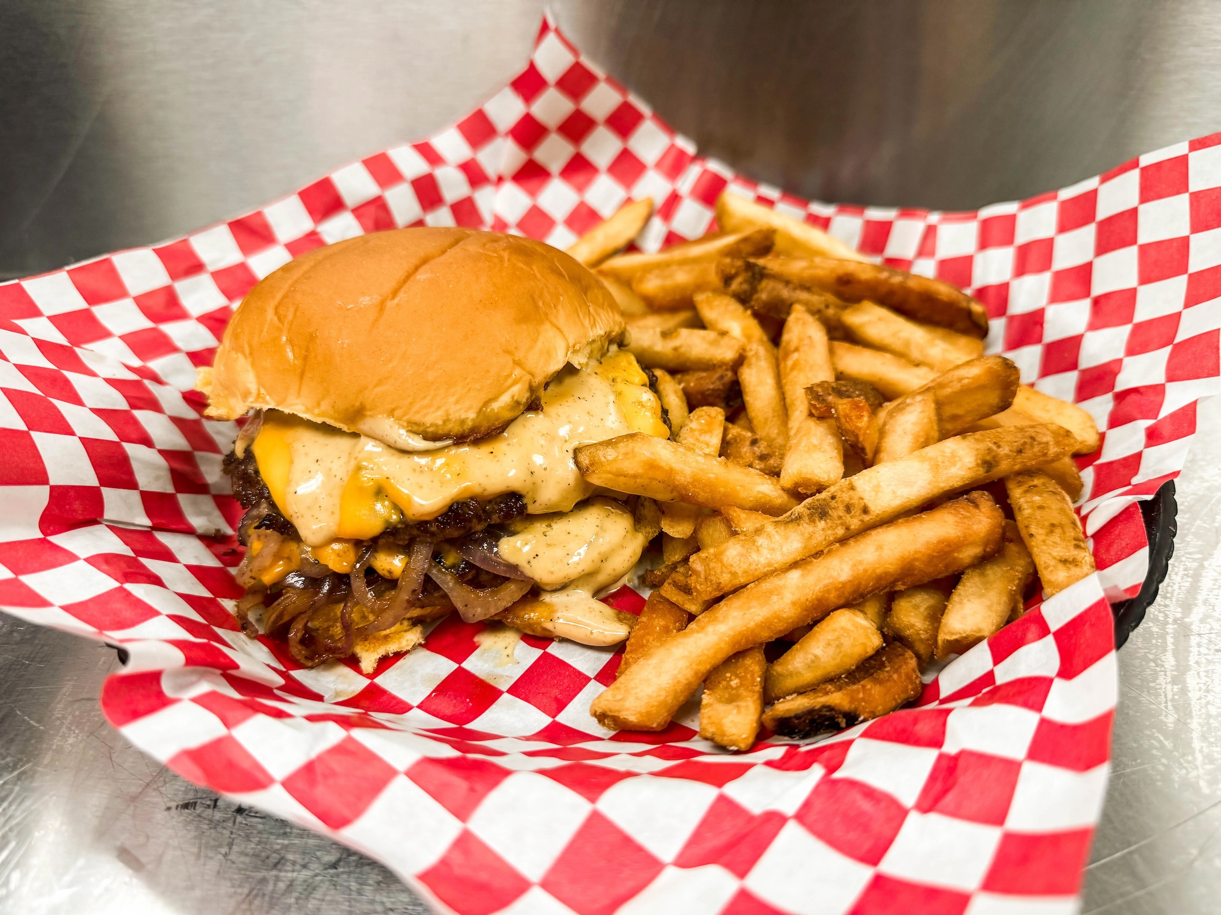 An onion smash burger at Newt's