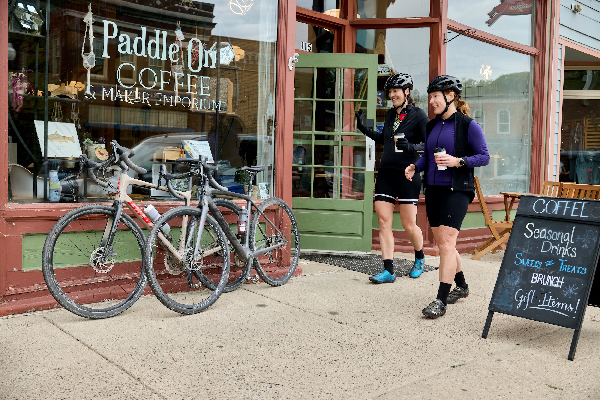A couple bikers stop at a coffee shop along the Root River State Trail