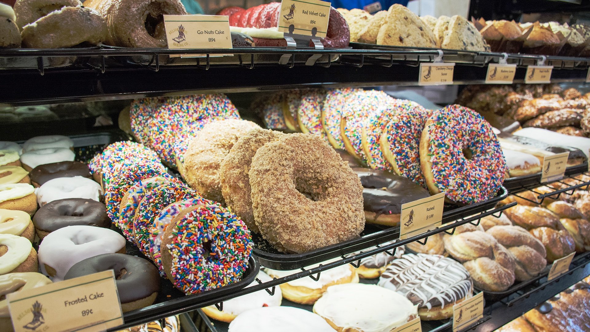 A glass case full of Nelson Bros. donuts