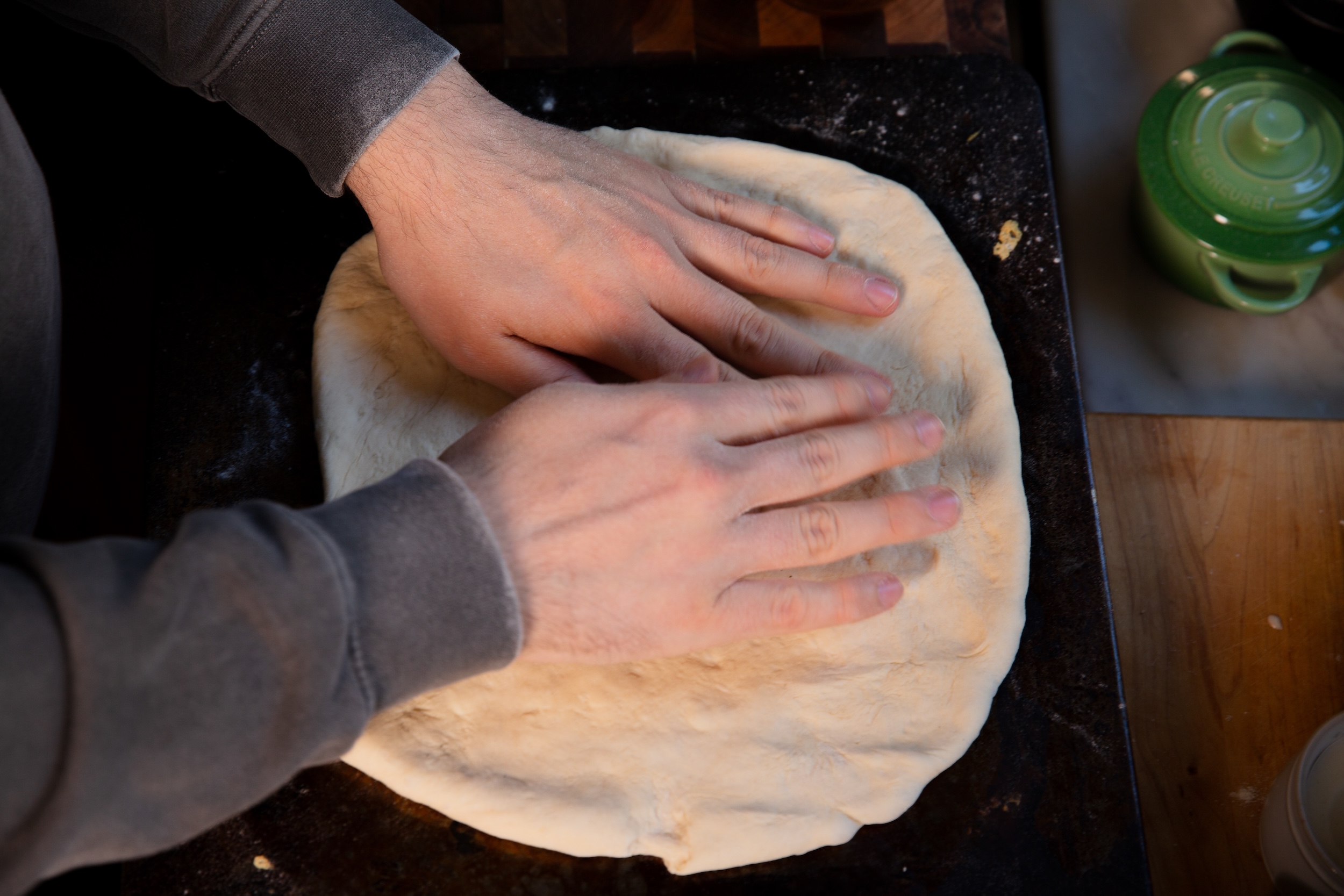 Hayden Haas kneading his pizza dough