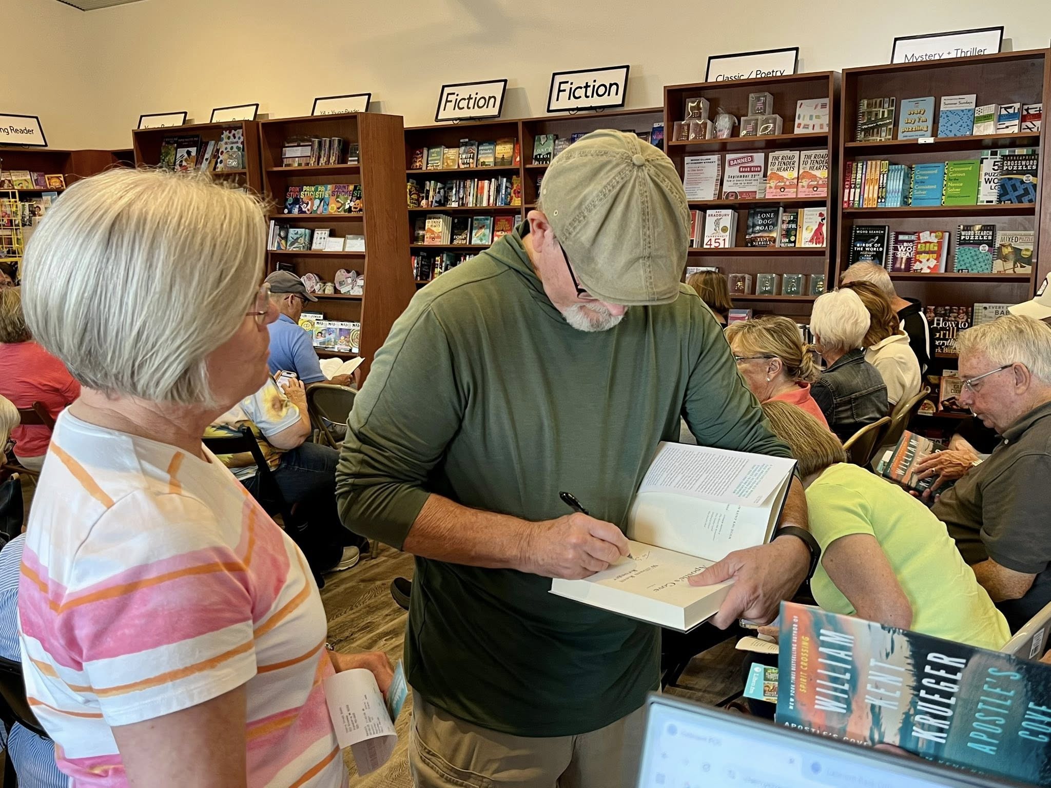 Minnesota author William Kent Krueger signs his latest work at Cherry Street Books