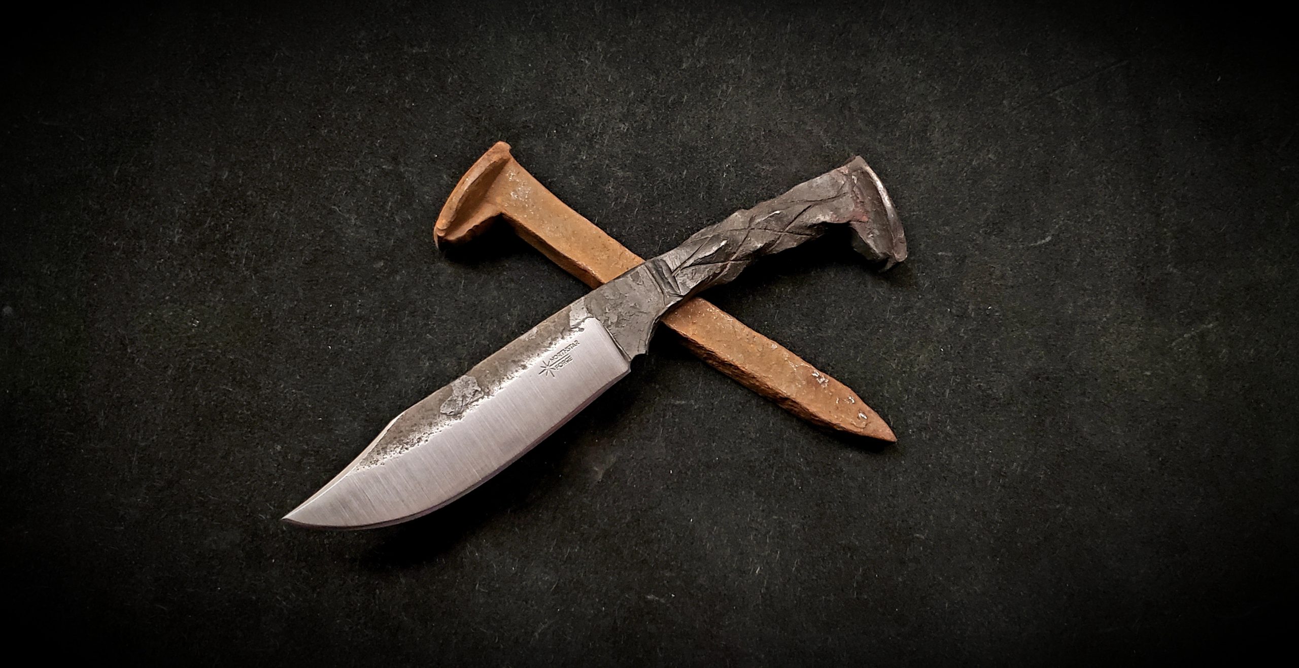 A Railroad Spike Knife made by Northstar Forge
