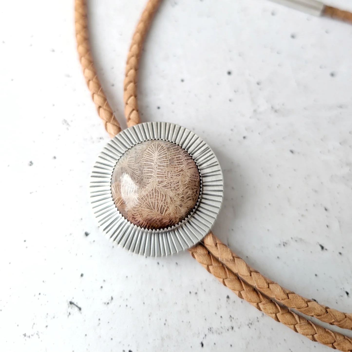 A fossilized coral bolo tie from Jovy Rockey Jewelry