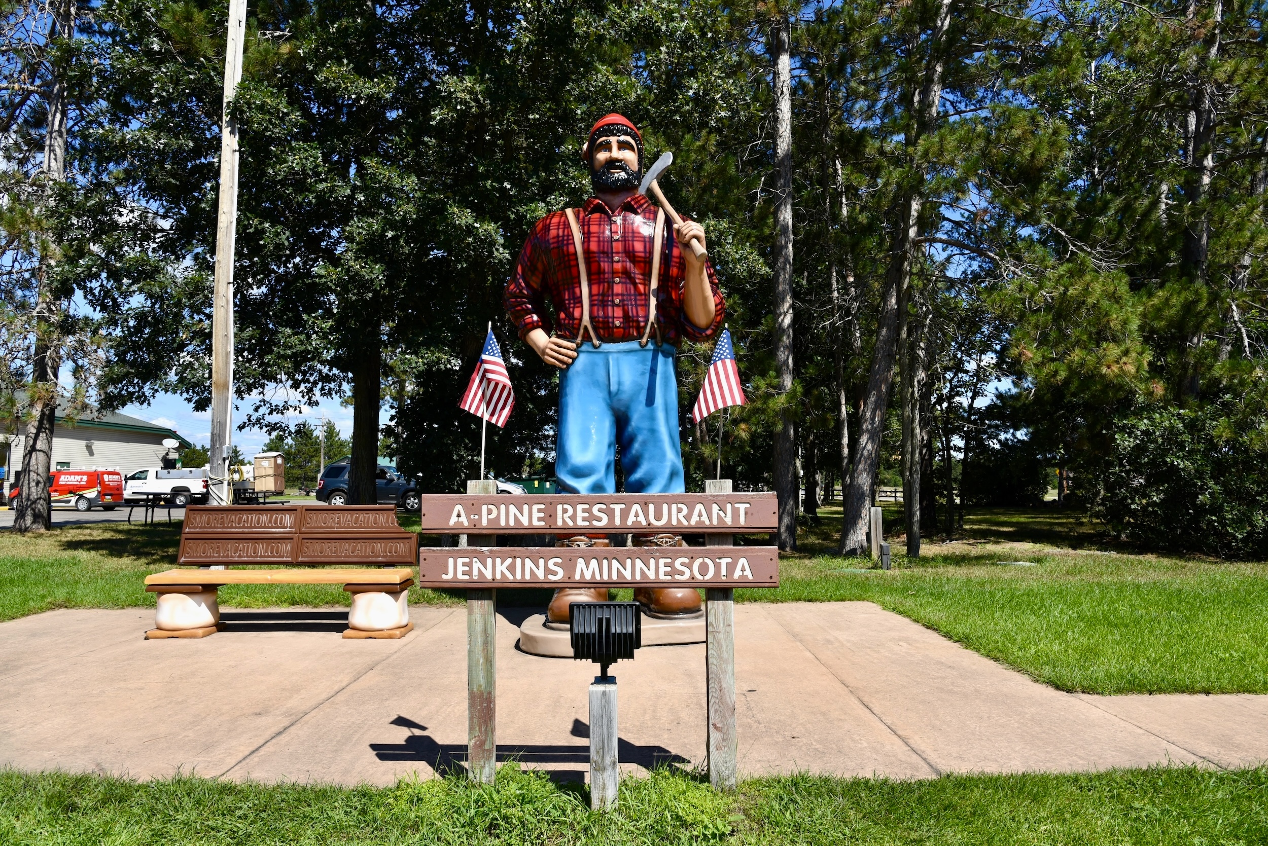 The Paul Bunyan statue and s'mores bench next to A-Pine Restaurant