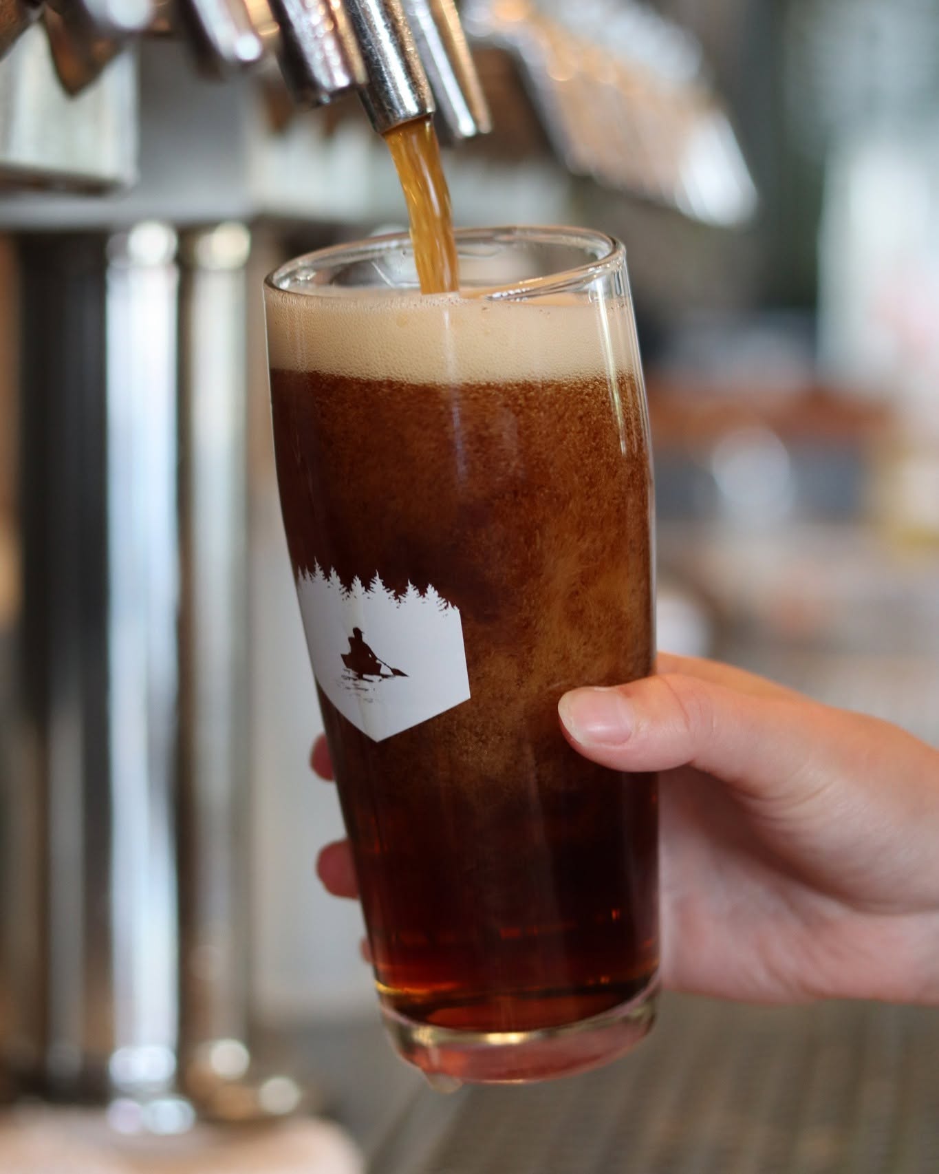 A pint being poured at Portage Brewing Company