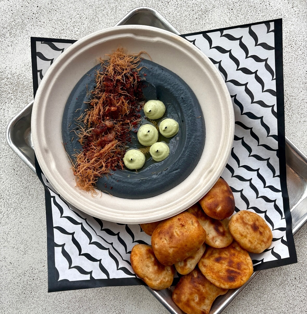 A black sesame hummus bowl special at Baba's Hummus House