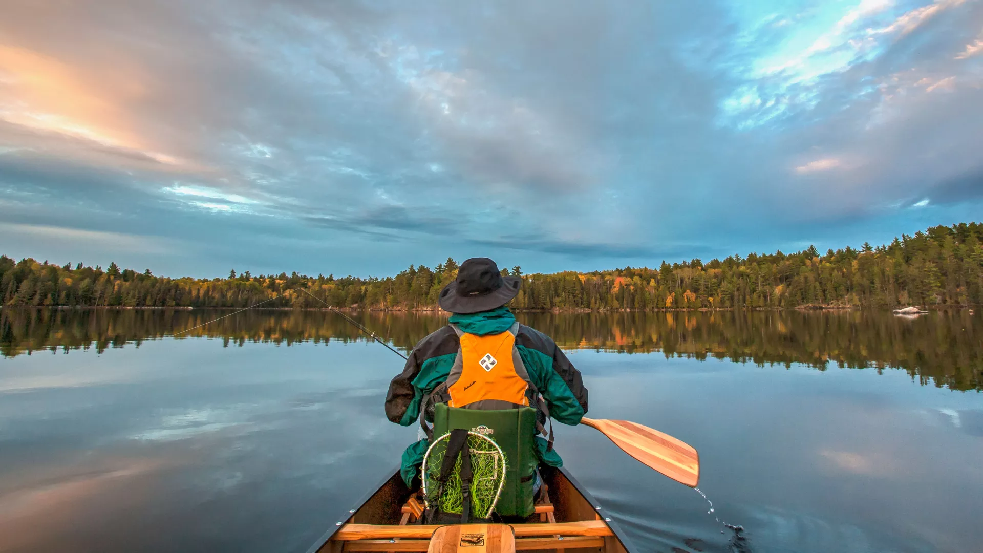 Man fishing from canoe