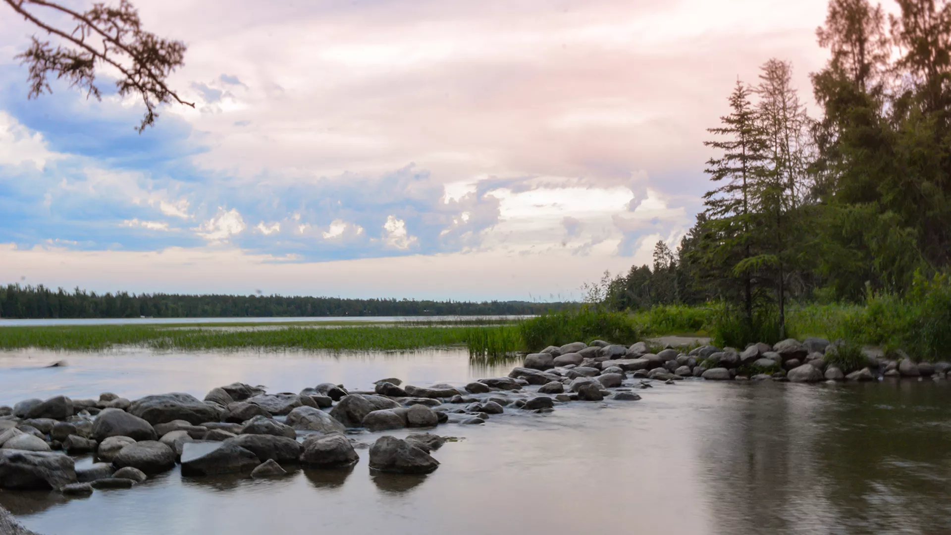 The Mississippi River headwaters under a pastel sky at Itasca State Park