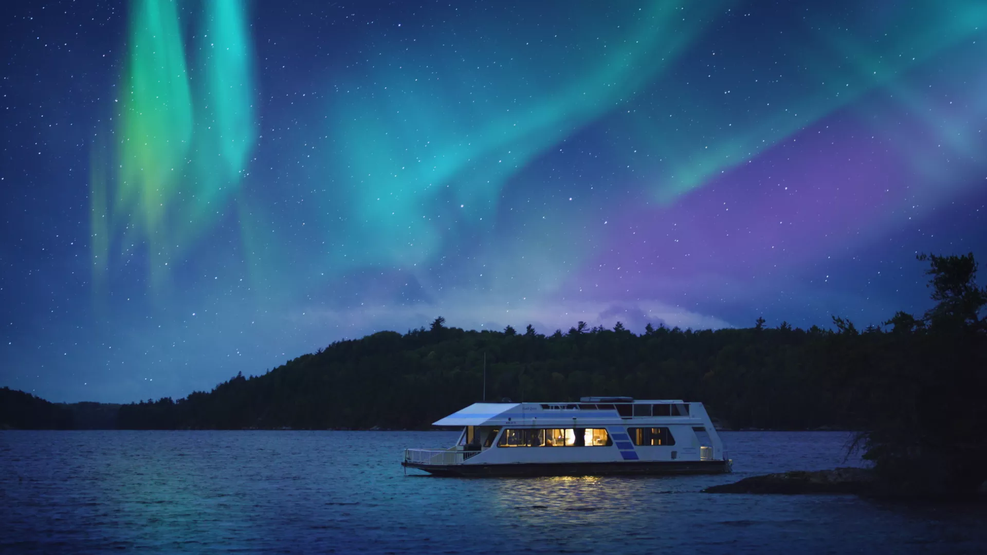 Northern lights over a houseboat in Voyageurs National Park