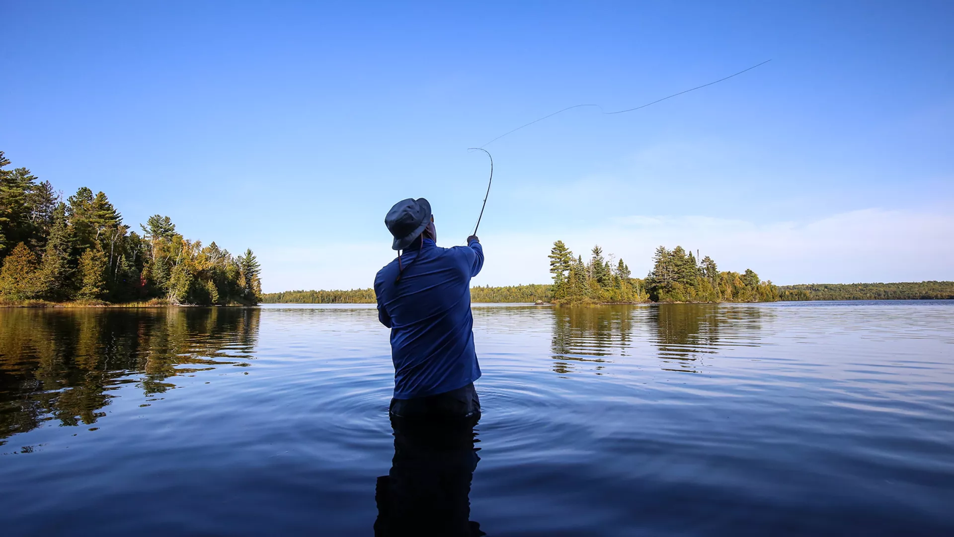 Fly fishing in the clear waters of Superior National Forest