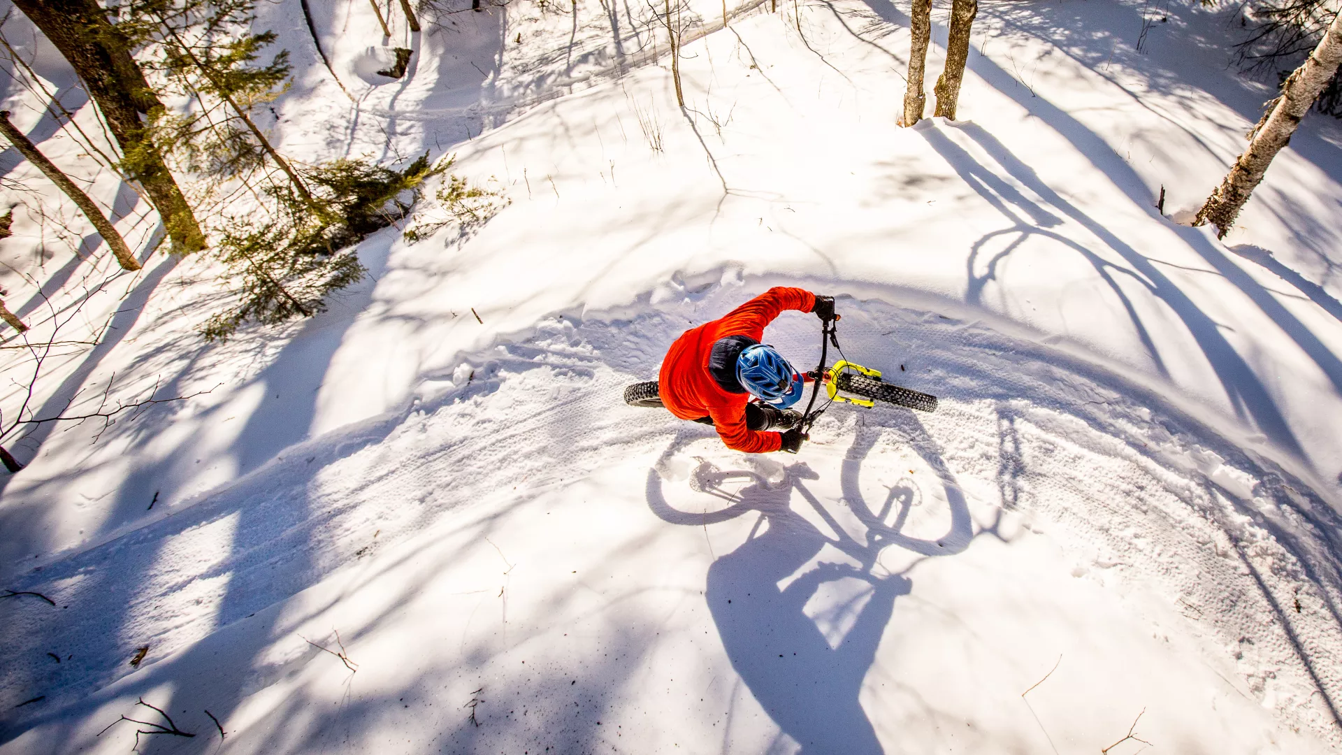 Winter fat biker going around a berm while riding in Duluth