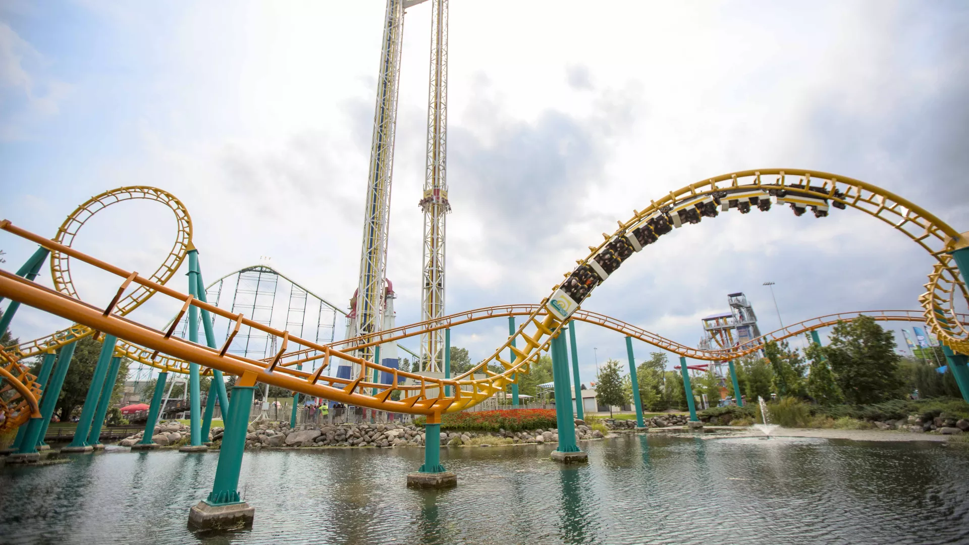 Riders do a 360-degree loop on the orange, Corkscrew roller coaster at Valleyfair
