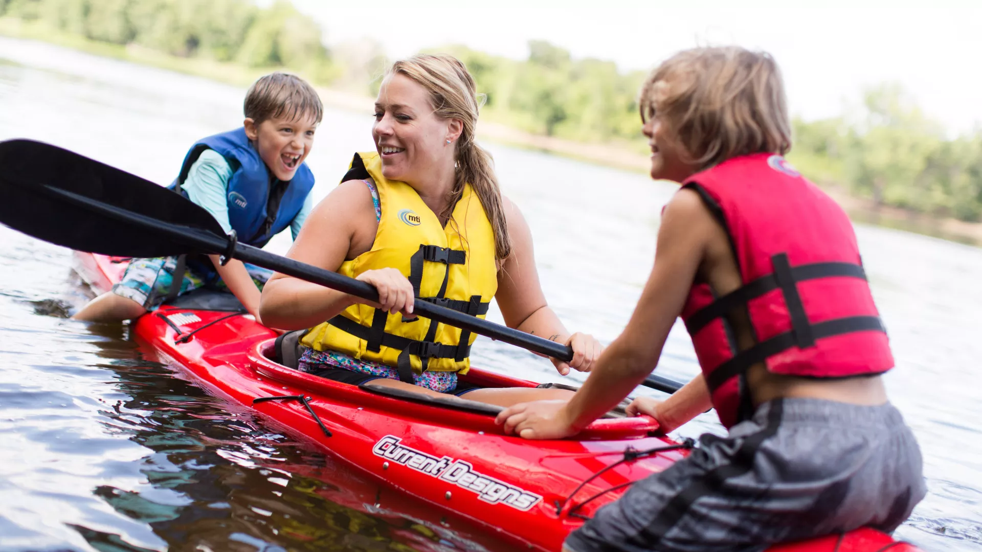 A family kayaking on the Mississippi River