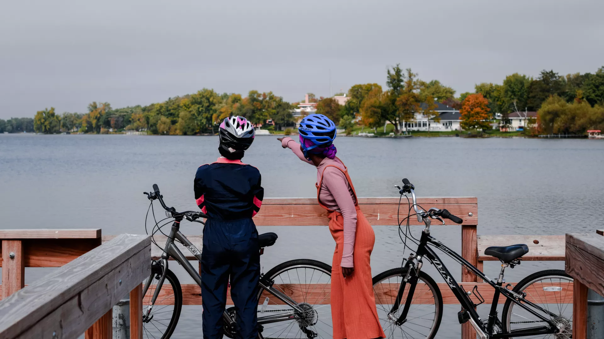 Two women bike the Sauke Lake stretch of the Lake Wobegon Trail