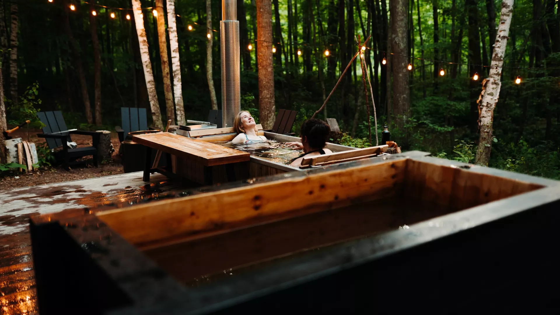 Two women enjoy the hot tub at Silvae Spiritus
