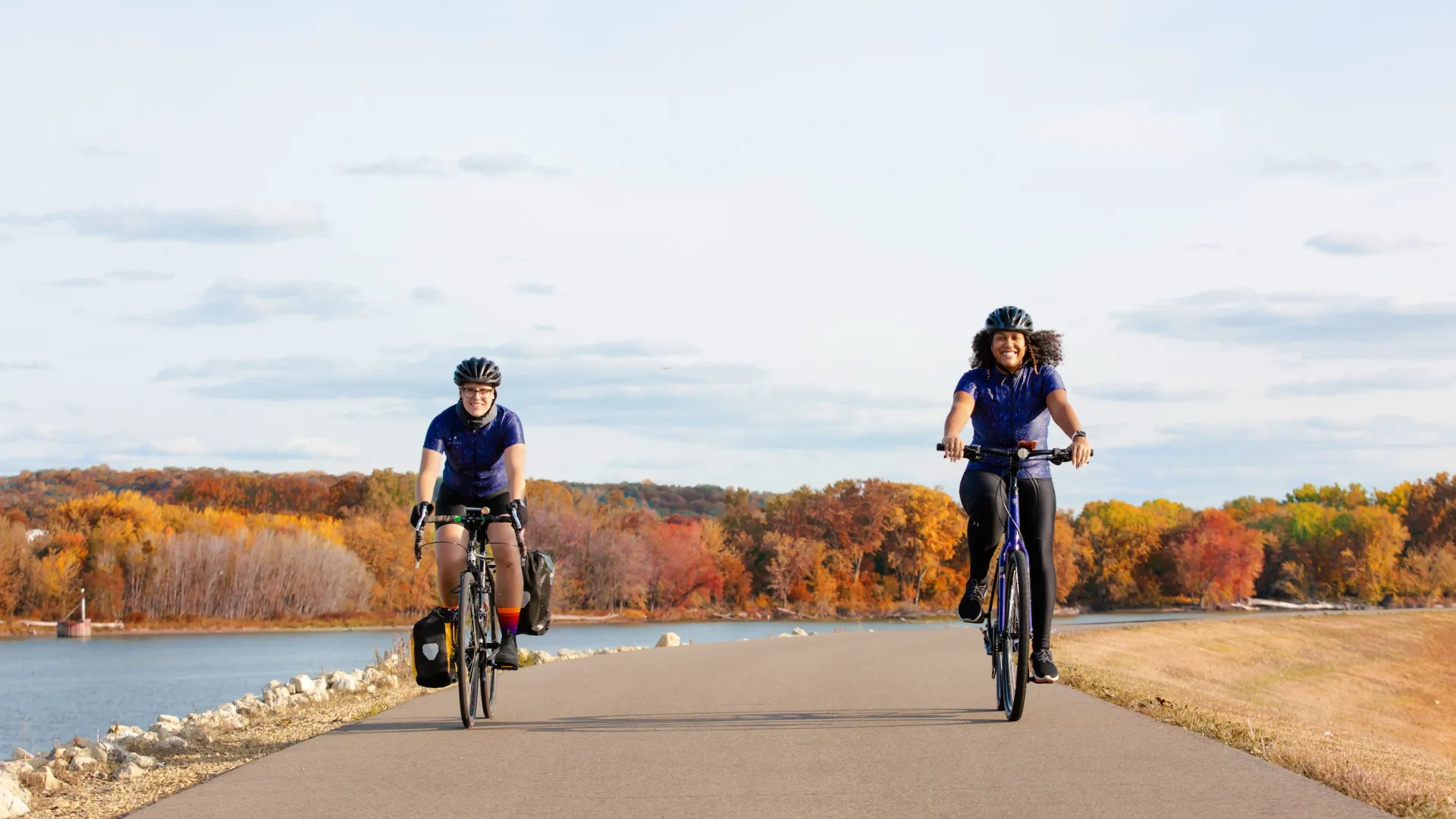 Two women bike along the Mississippi River Trail in South St. Paul