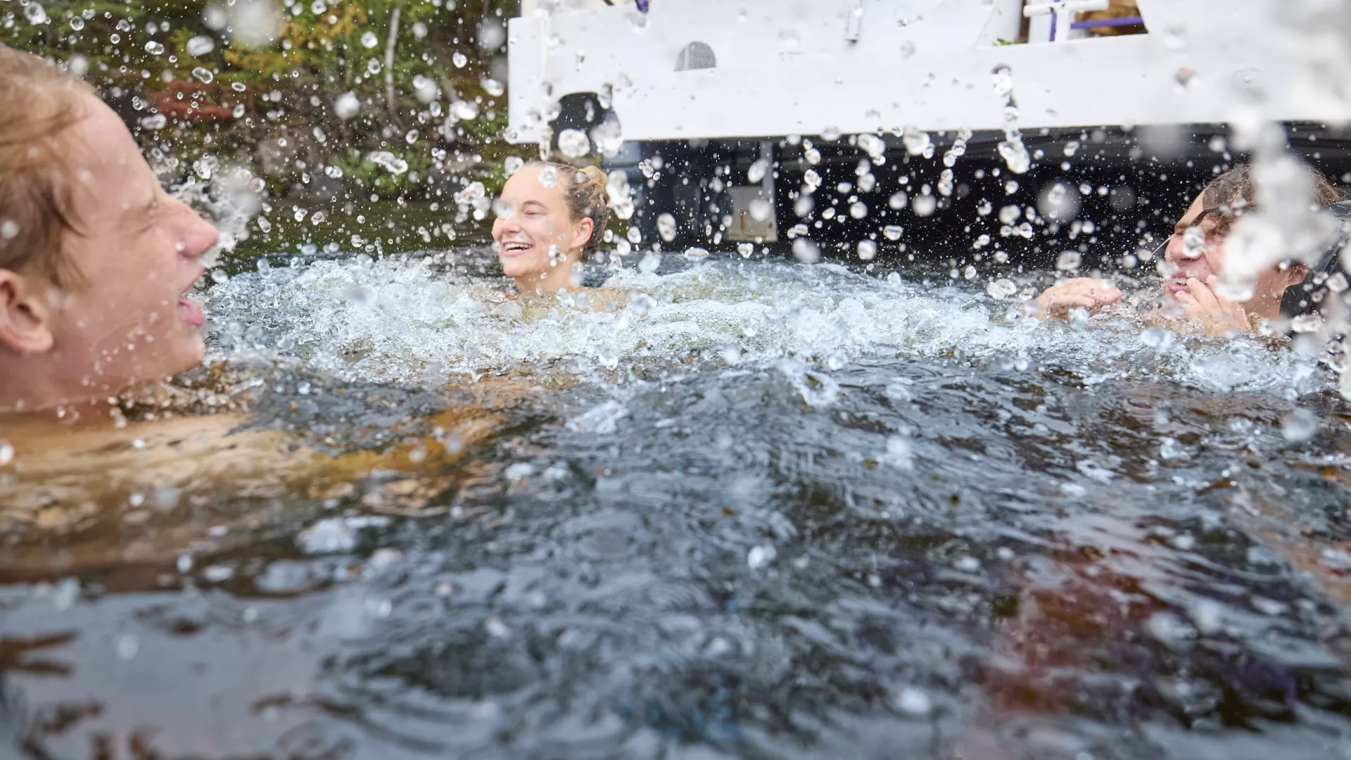 A group of friends go swimming in Voyageurs National Park