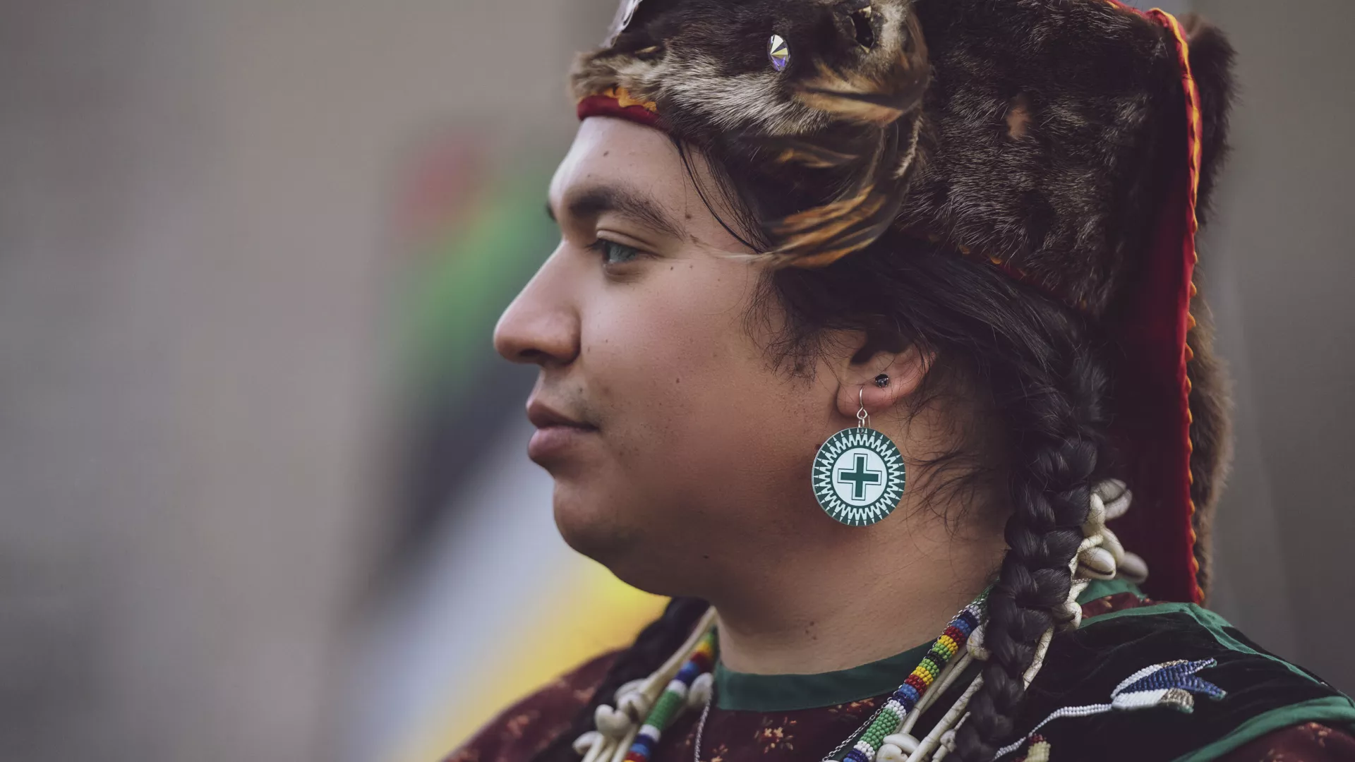 A model wears earrings by Četáŋ Ská designer Dyani White Hawk