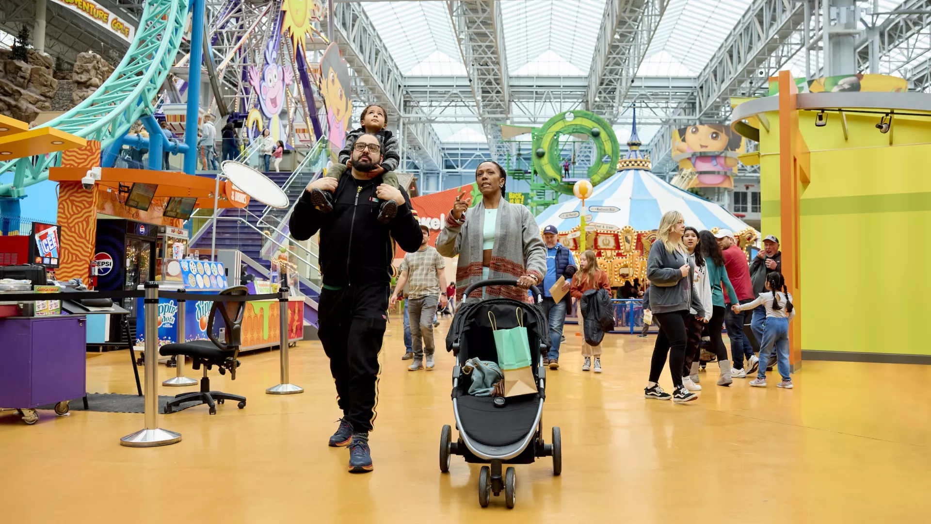 A family walks around Nickelodeon Universe at Mall of America