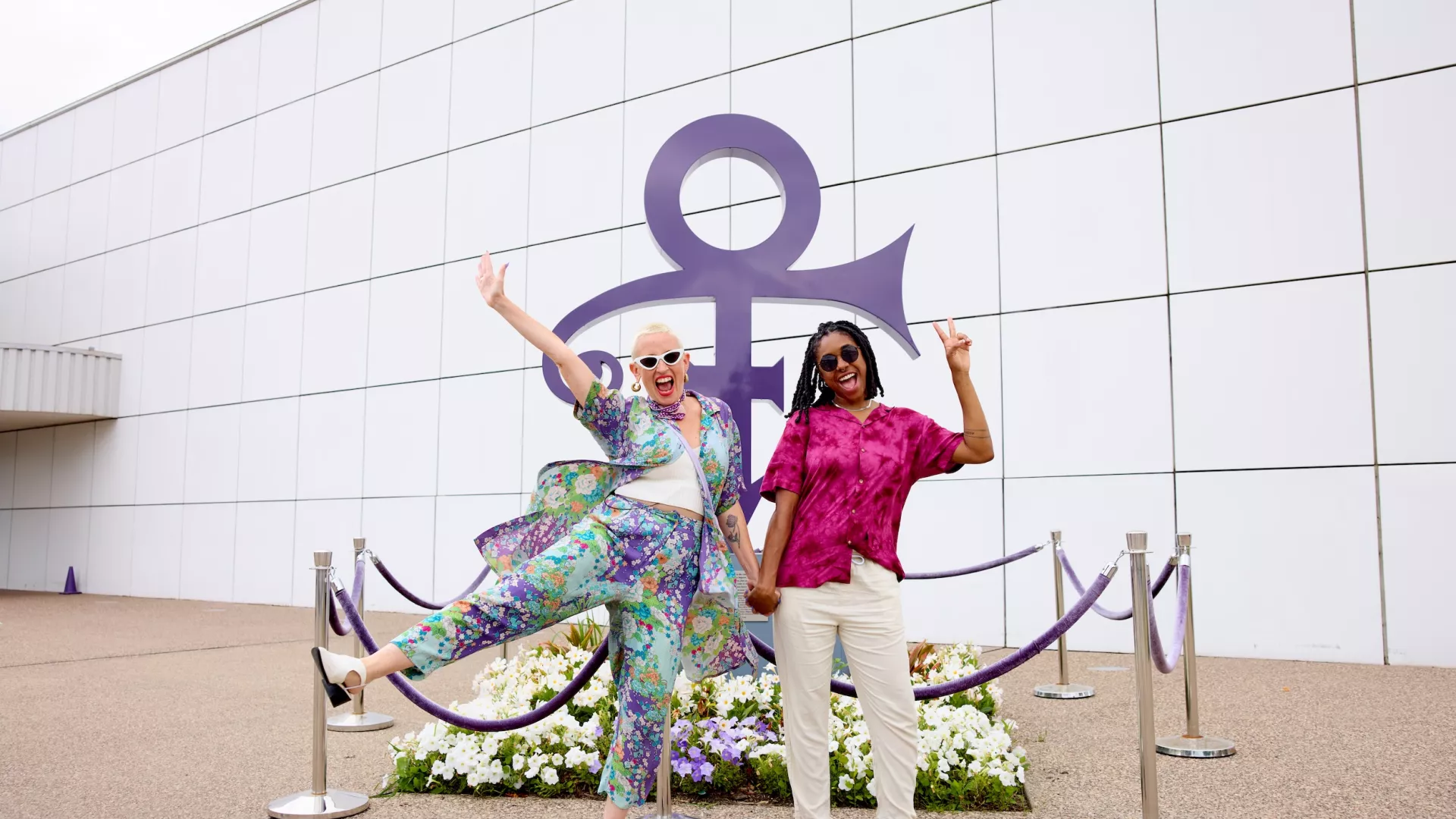 A couple poses outside Paisley Park