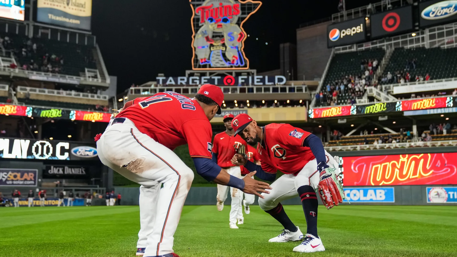 A couple Minnesota Twins players celebrate at Target Field