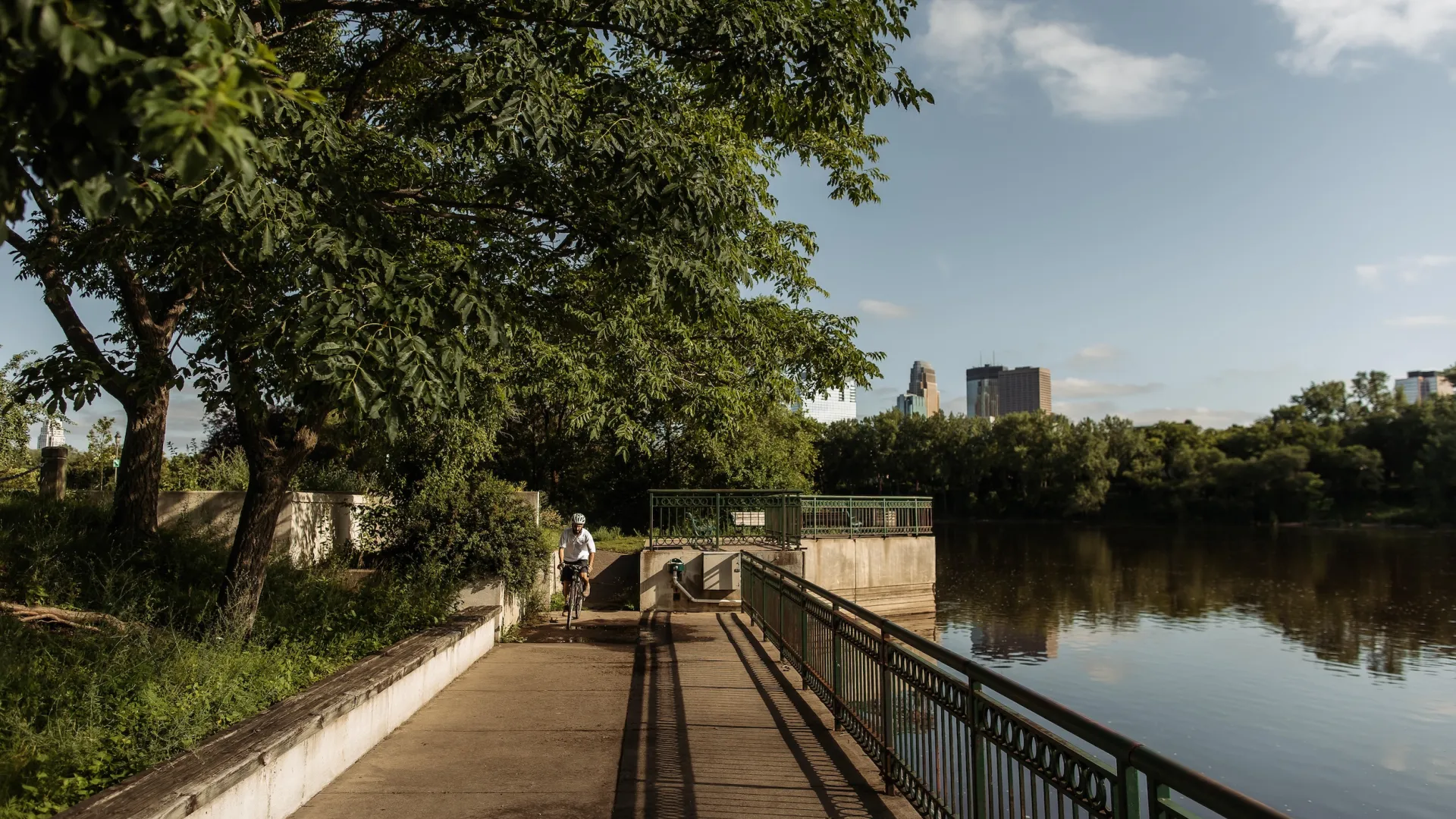 A man bikes on Boom Island in Minneapolis