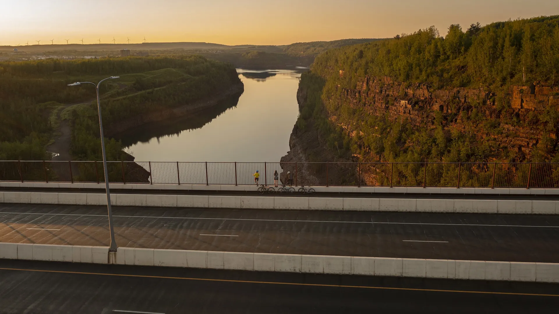 Bikers look out from the Thomas Rukavina Memorial Bridge in Virginia