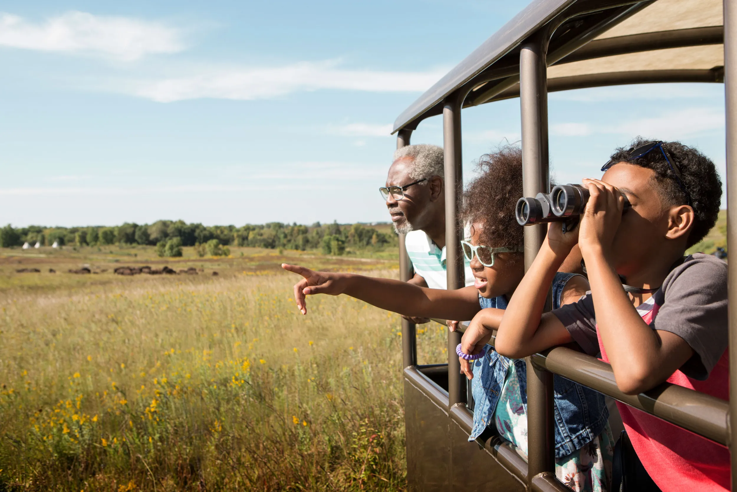 Family on bison buggy at Blue Mounds State Park