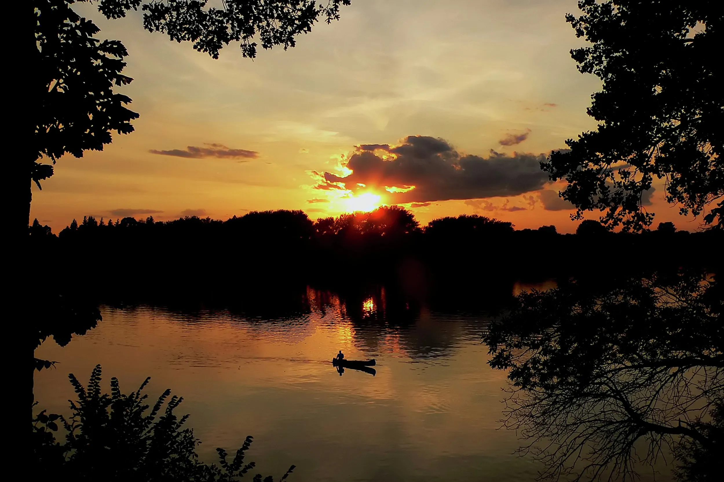 A fishing boat on a lake at sunset in Fairmont