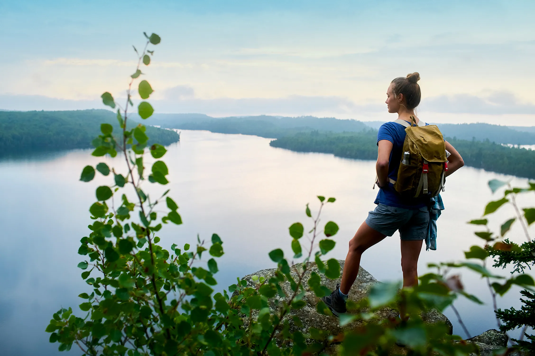 Woman hiking Honeymoon Bluff in Grand Marais