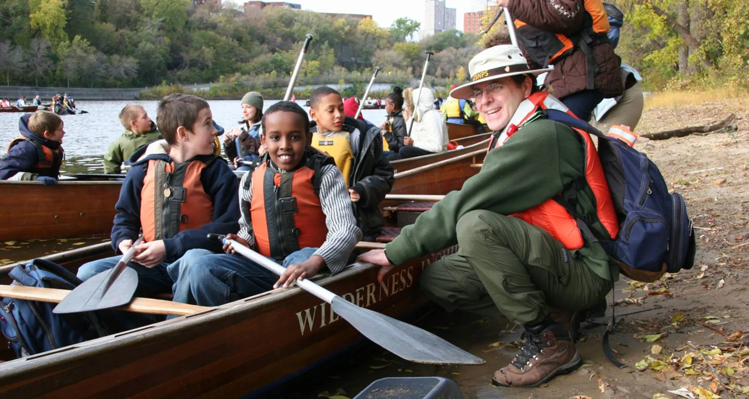 Ranger Brian with kids in canoes